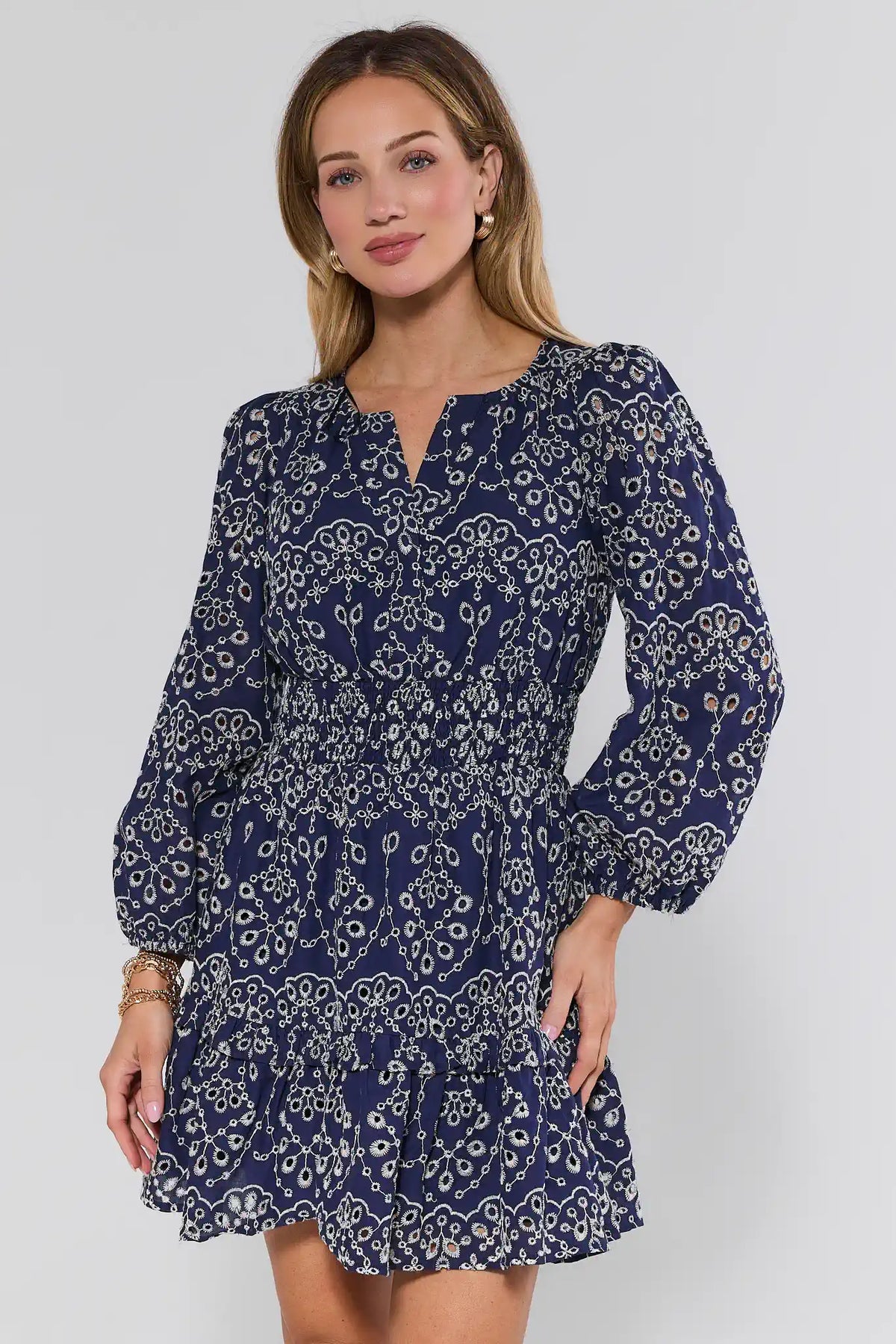 Emmie Navy Eyelet Embroidered Short Dress - Front View, Long Sleeves & Smocked Waist | Avara