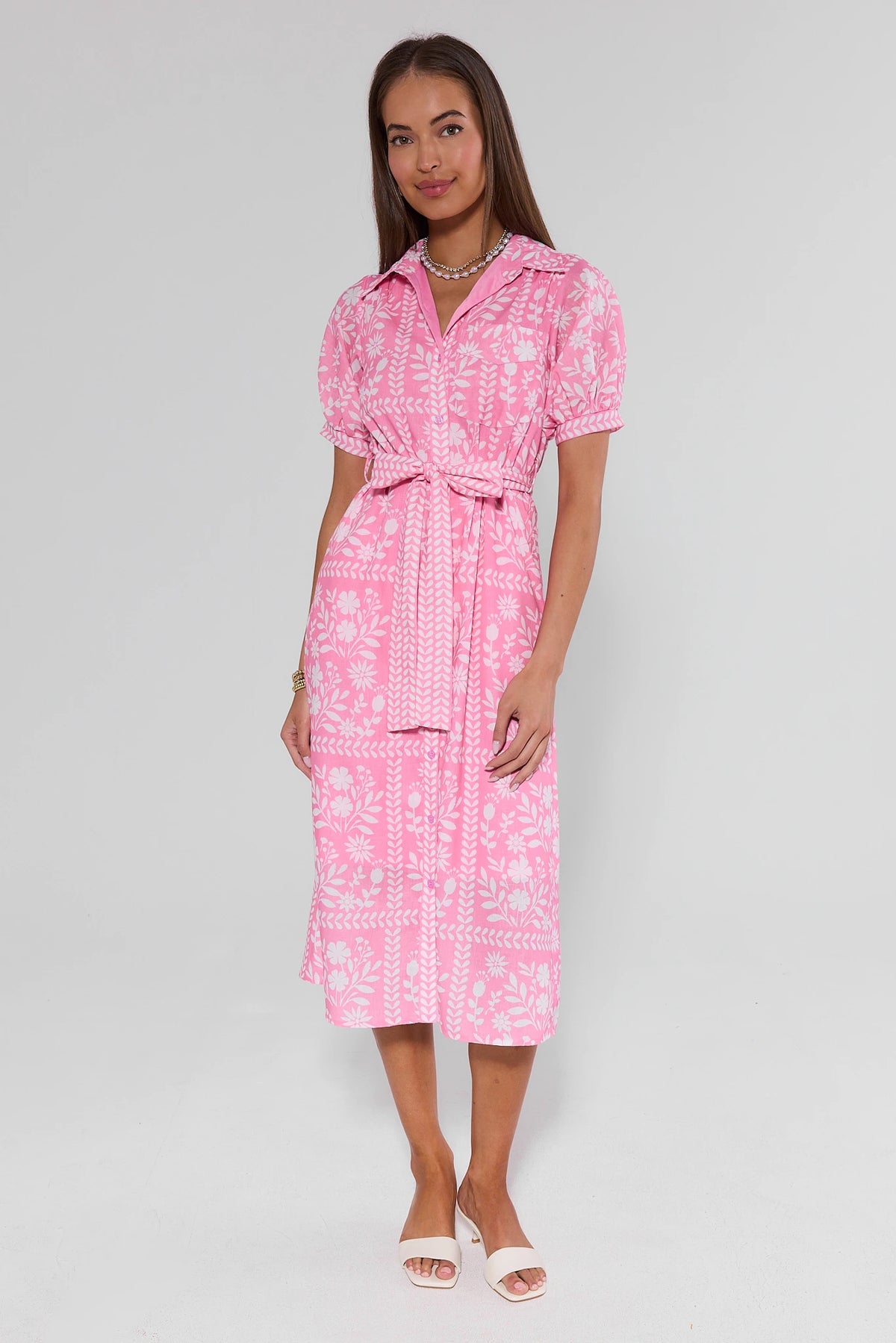 Pink floral print Magnolia modest midi dress full length front view with tie waist and kitten heels | Avara