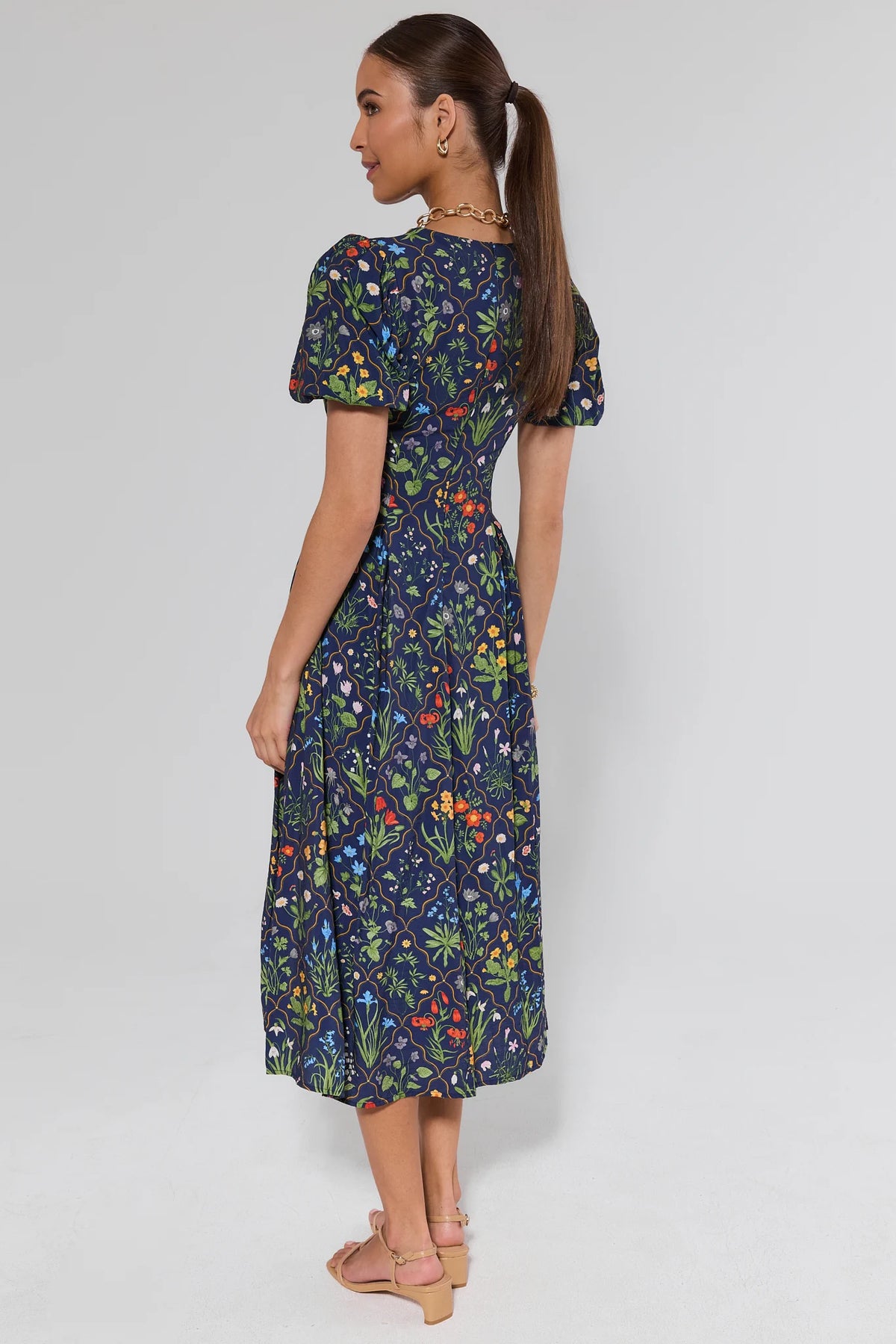Kaidyn Navy Floral Midi Dress - back view showing modest midi length and puff sleeves | Avara