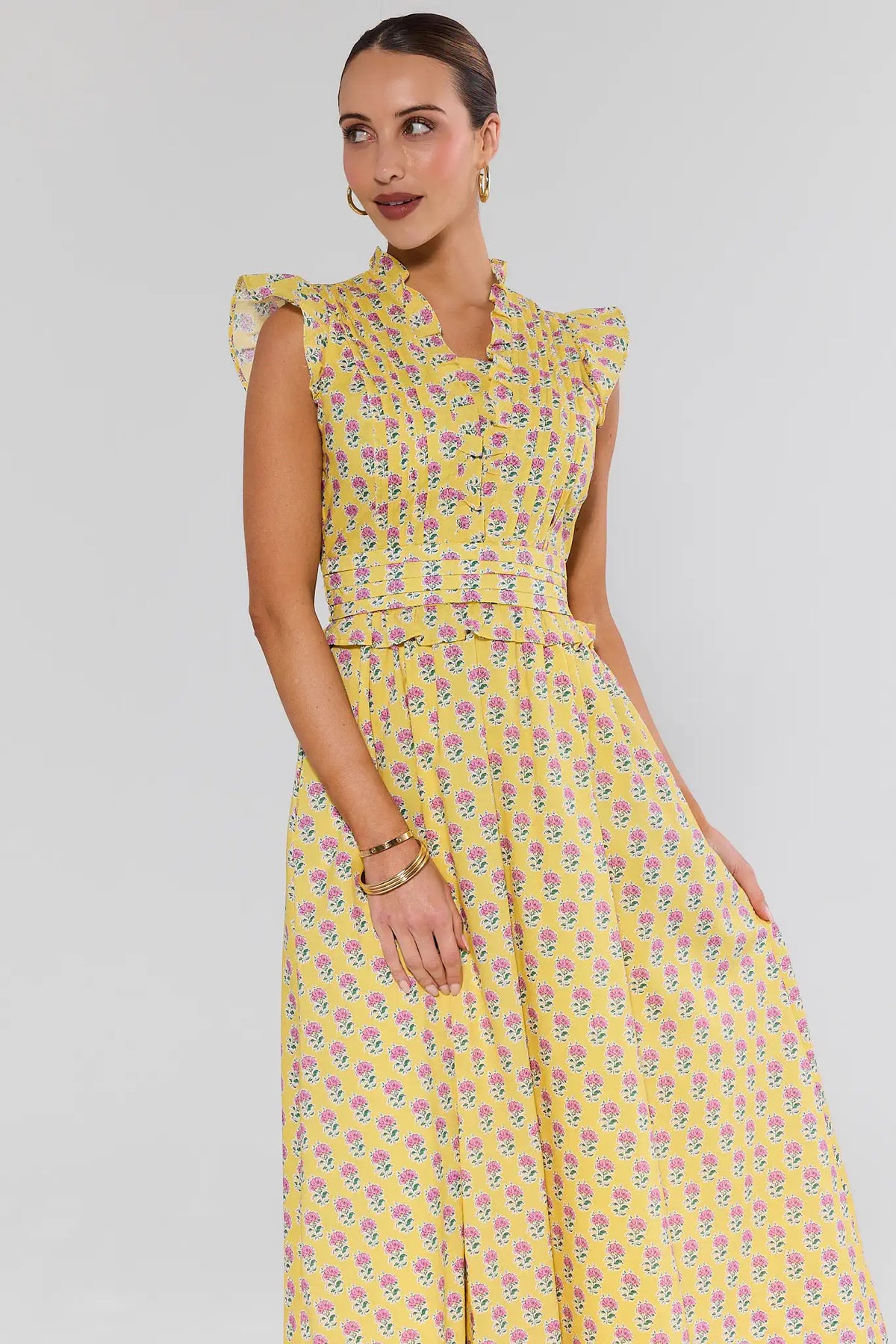 Magdalen Yellow Floral Maxi Dress - Front 3/4 View, flutter sleeves and peplum waist | Avara