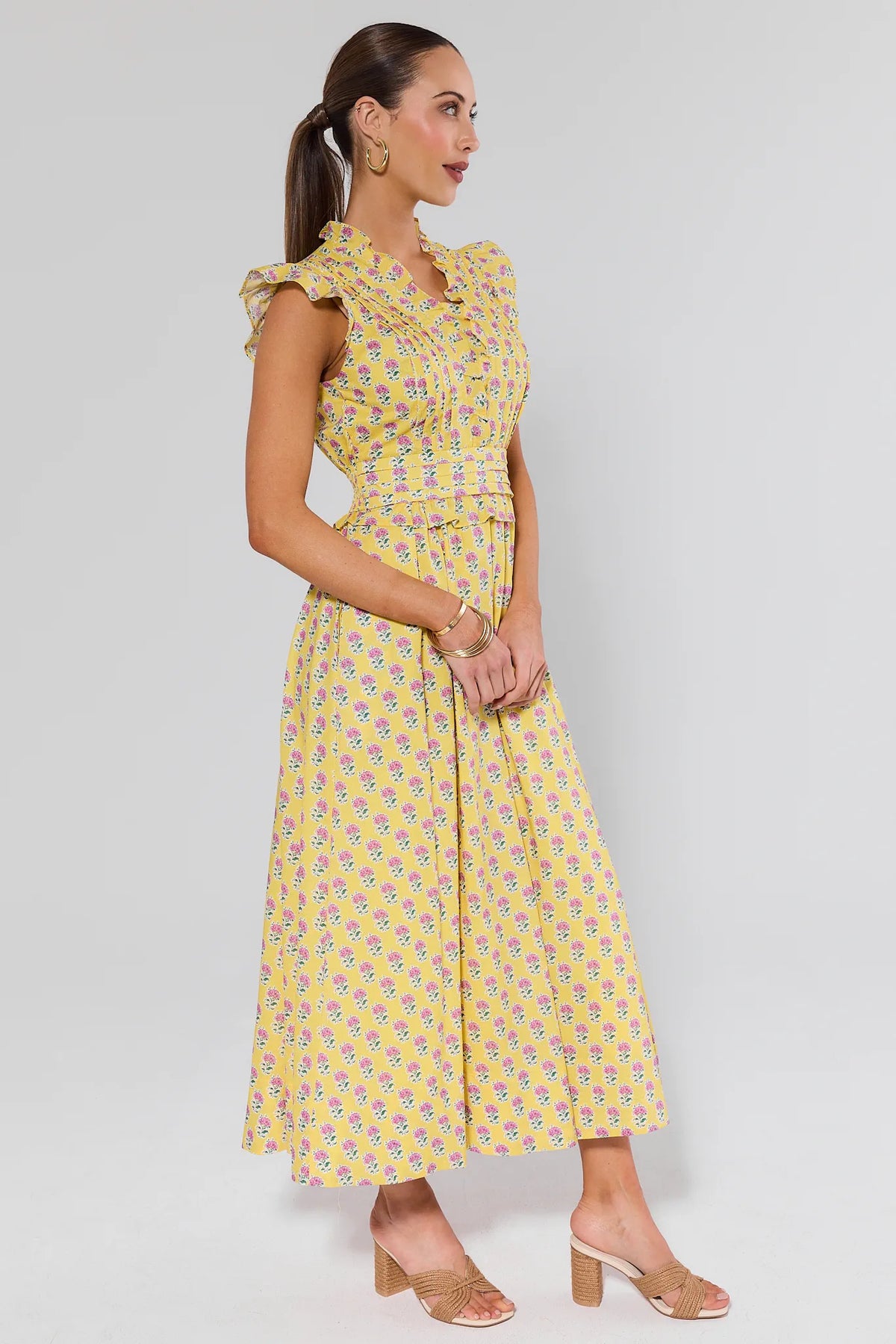 Magdalen Yellow Floral Maxi Dress - Side Profile View, A-line skirt and ruffle sleeves | Avara