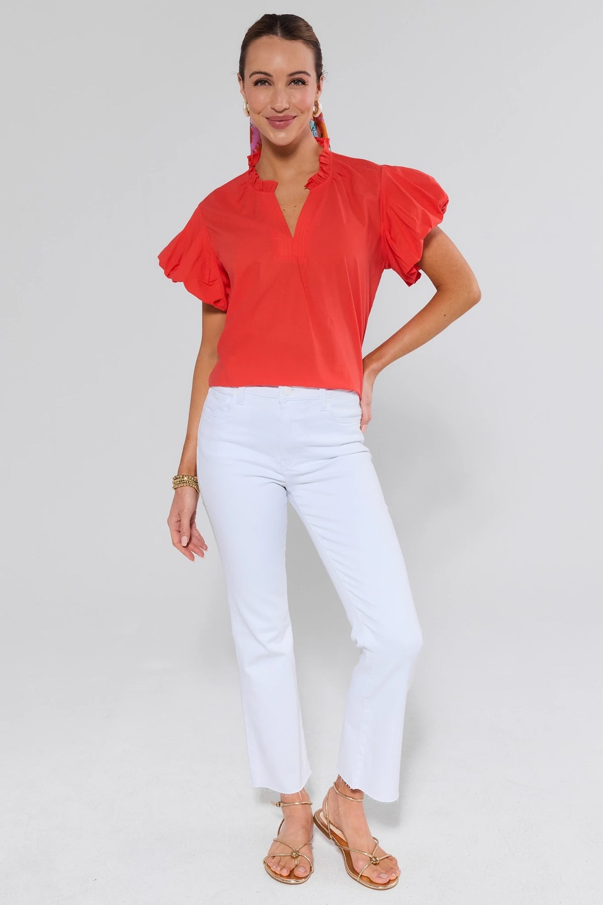 Agnes Orange Puff Sleeve Top with ruffle collar, styled with white pants - Full-Length Front View | Avara