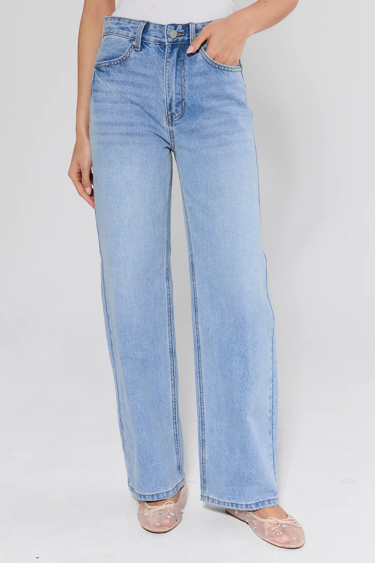 Laney Light Wash Wide Leg Jeans, high-rise front view with white tuck-in top and embellished ballet flats | Avara