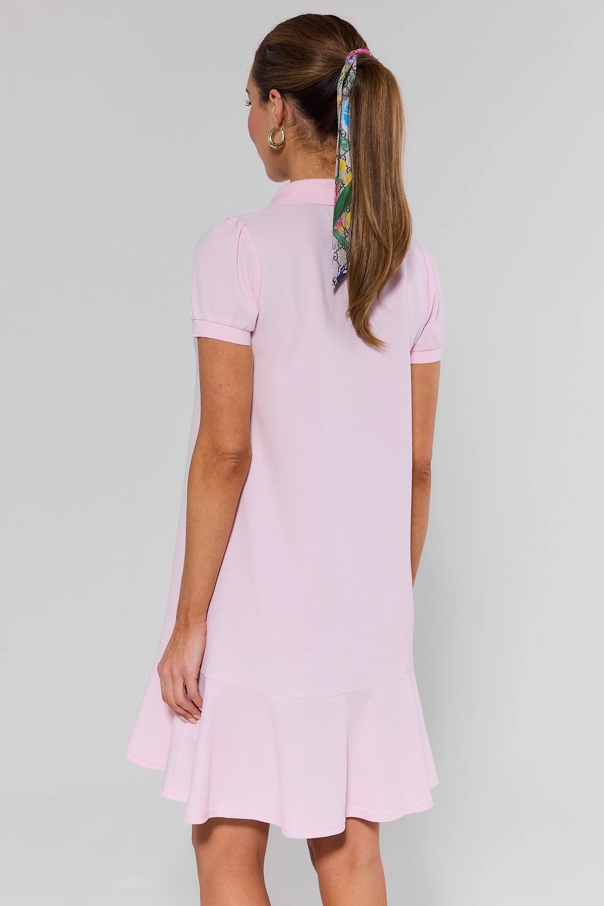 Emerson Pink Drop Waist Dress short sleeve and ruffle hem detail - Back View On Model | Avara