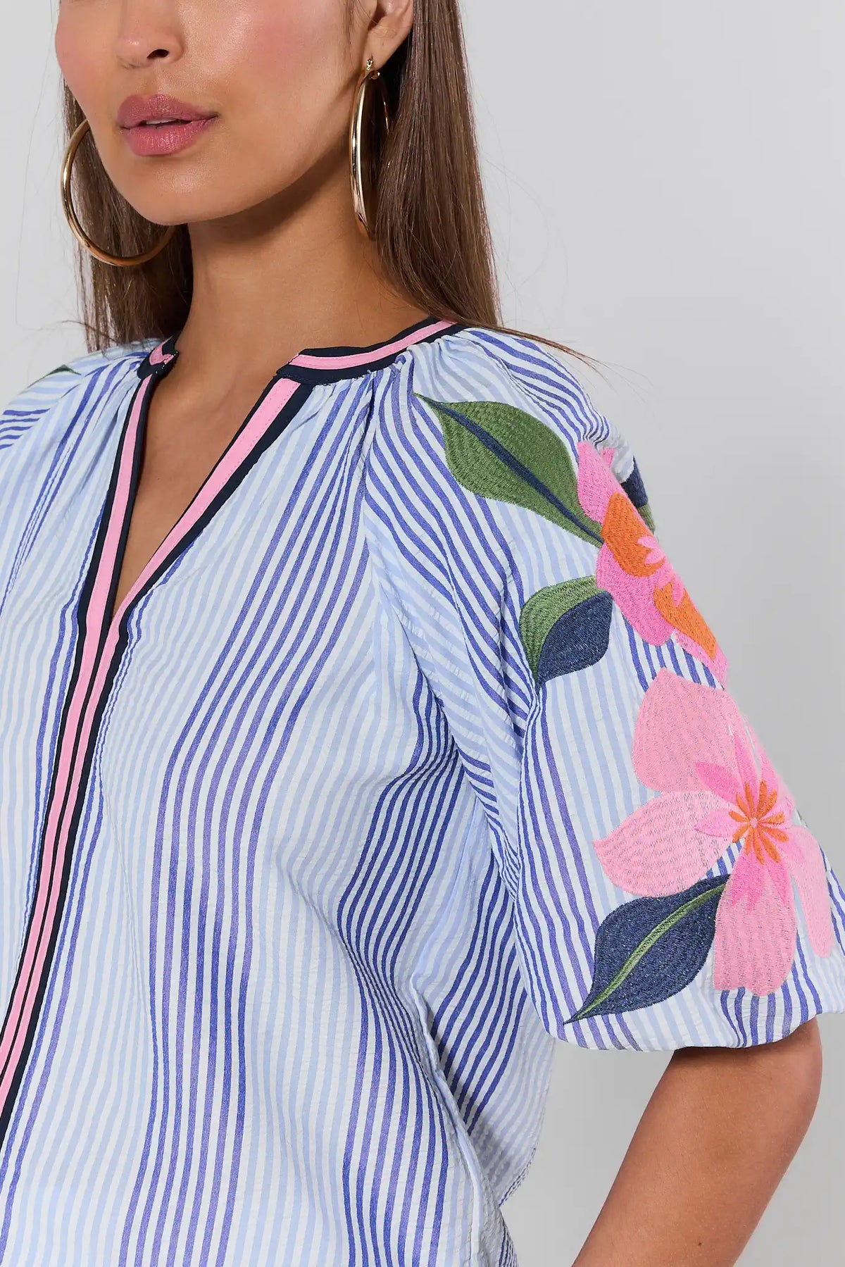 Blue striped THML top with pink floral embroidery on puff sleeves - Close-Up Detail | Avara