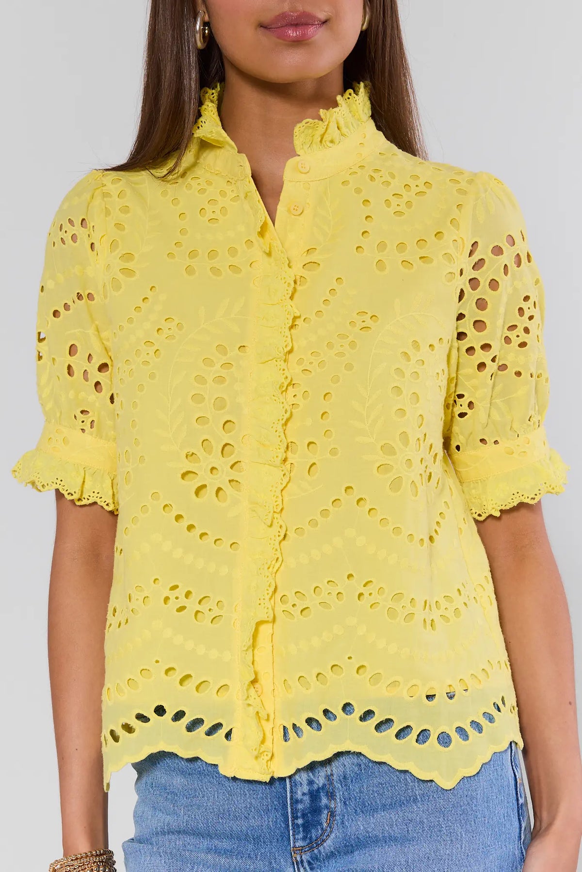 Yellow eyelet top with scalloped hem and ruffle sleeves - Close-Up Detail | Avara