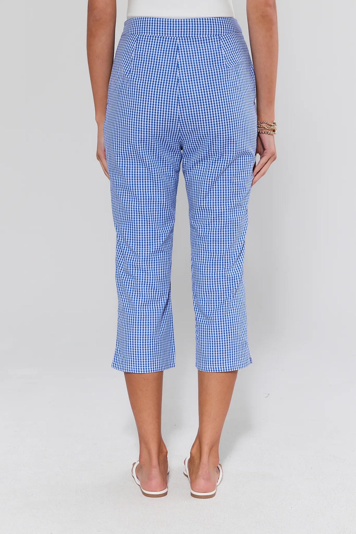 Blue gingham capri pants back view showing tailored fit and cropped hem on model | Avara