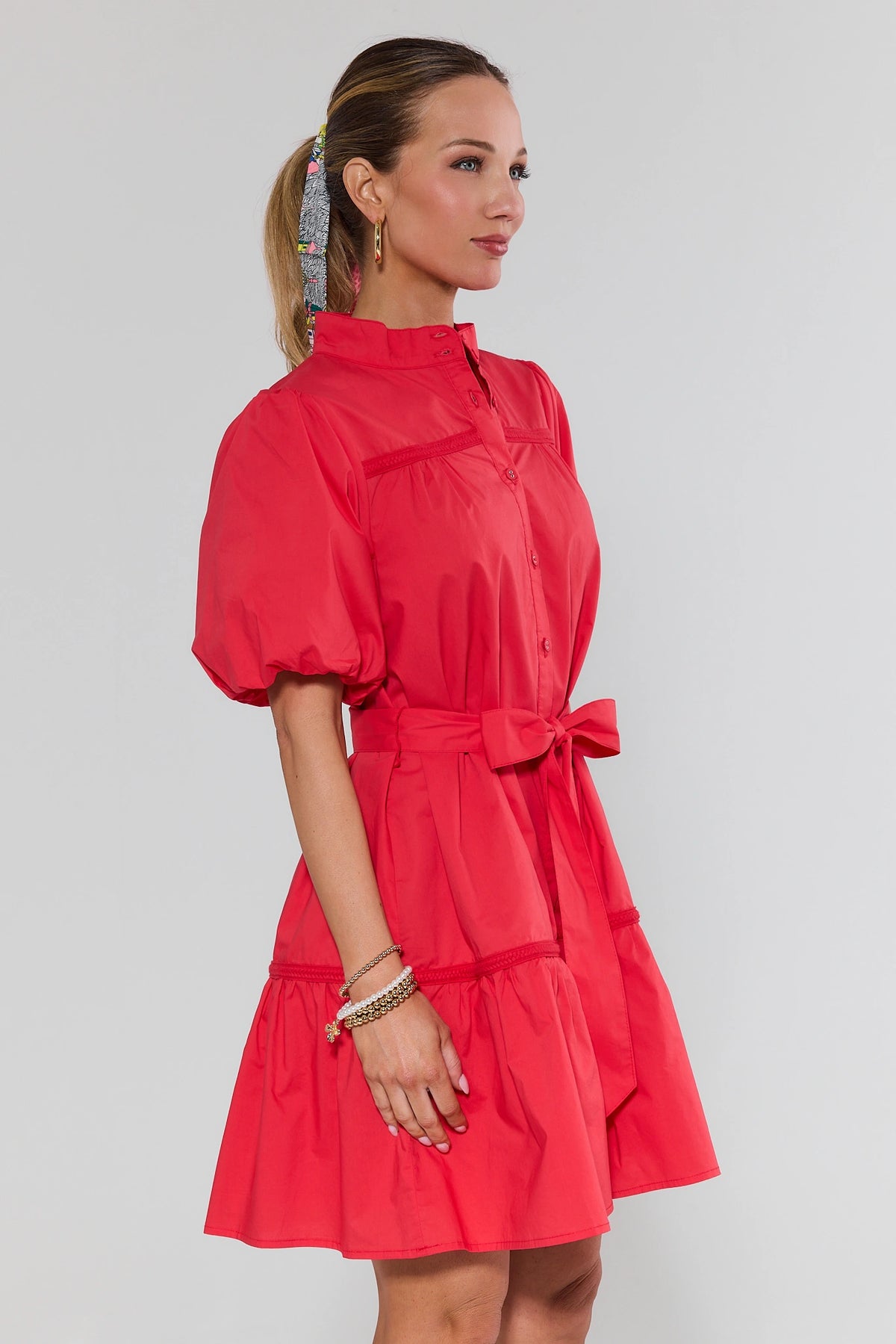 Jane Red Tie Waist Short Dress with puff sleeves and braided trim detail - Side Profile View | Avara