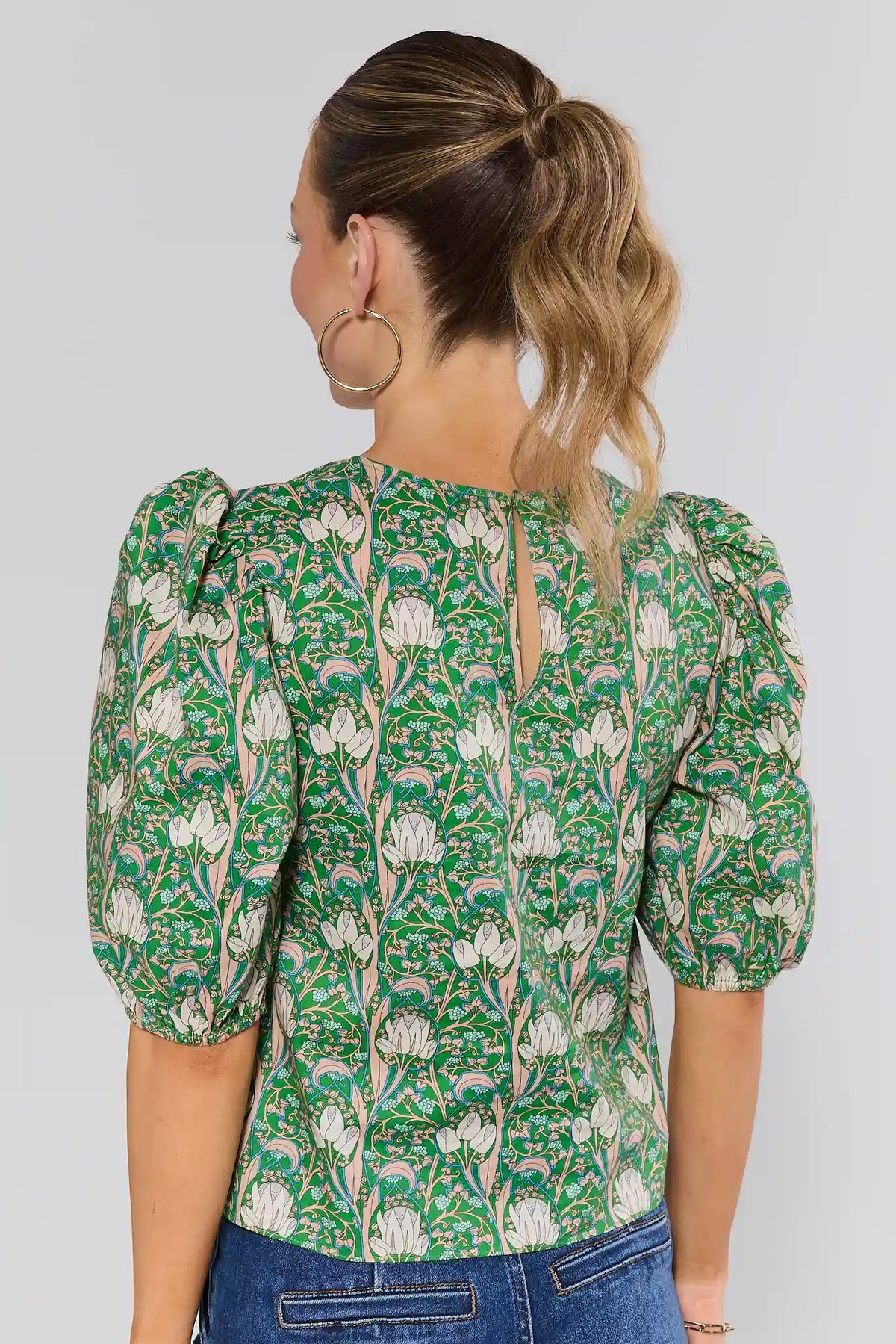 Kylie Green floral puff sleeve top back view with keyhole neckline detail on model | Avara