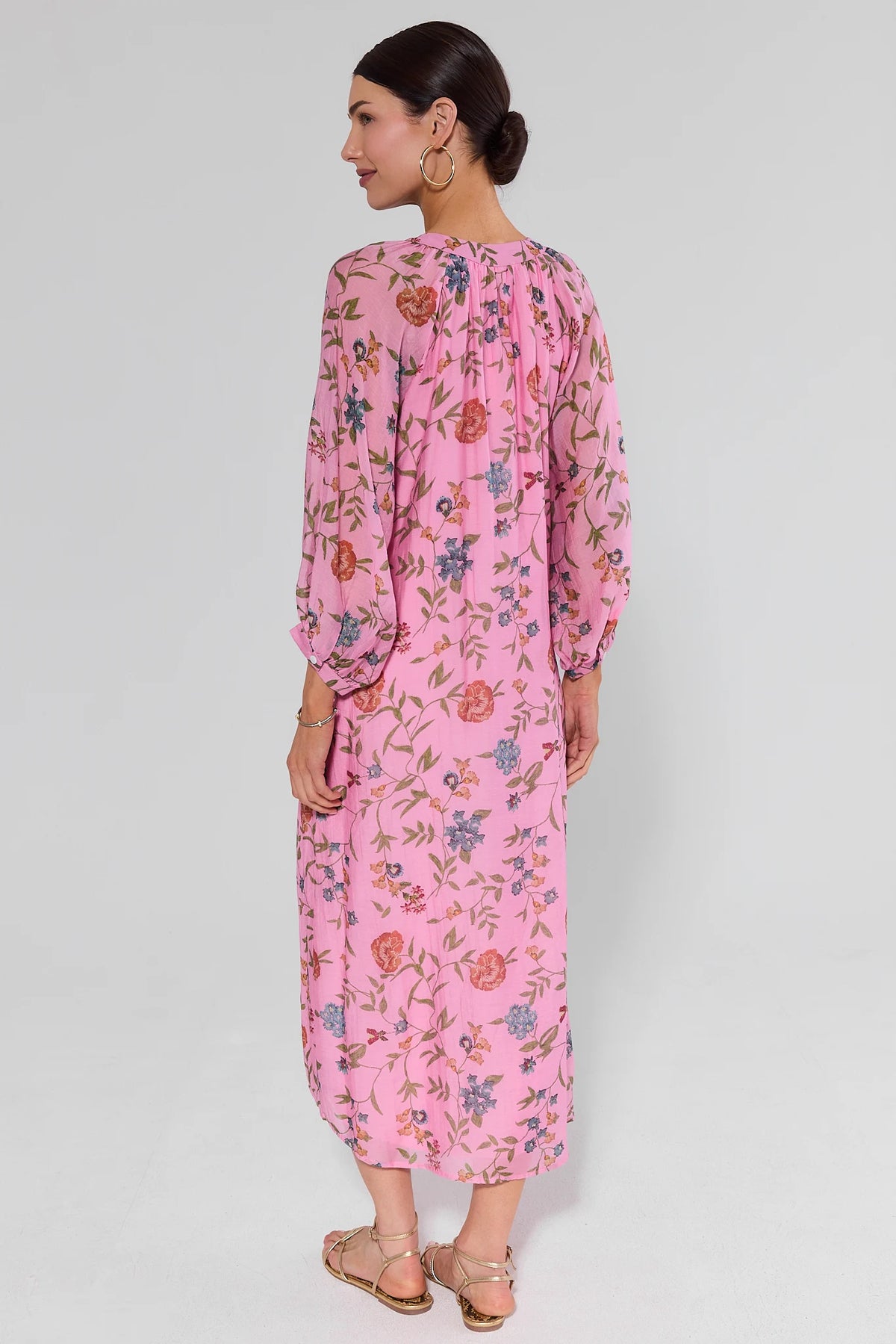 Back view of Gracen pink floral maxi dress with gathered neckline and full-length hem | Avara