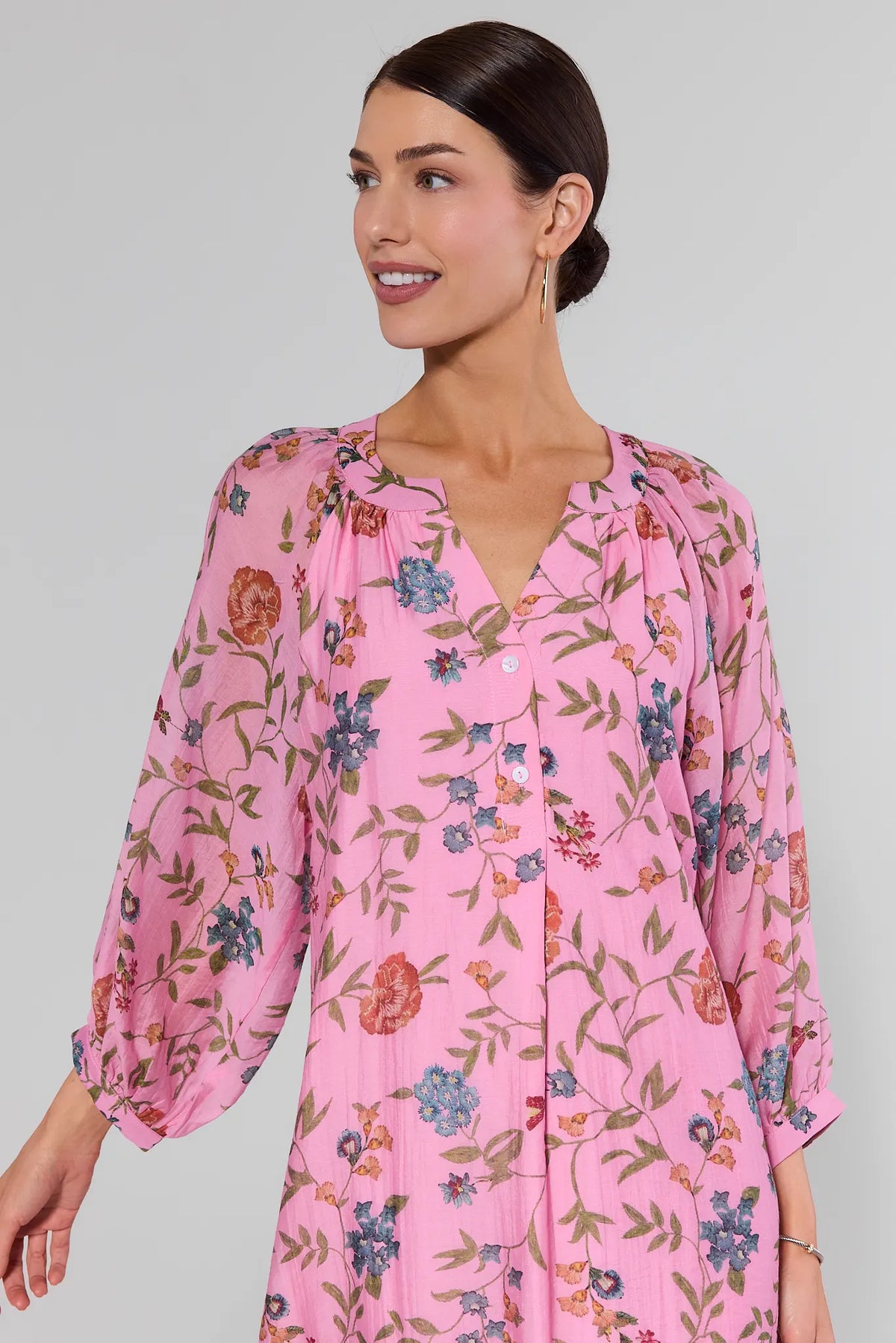 Close-up of Gracen pink floral maxi dress showing V-neckline and button detail | Avara