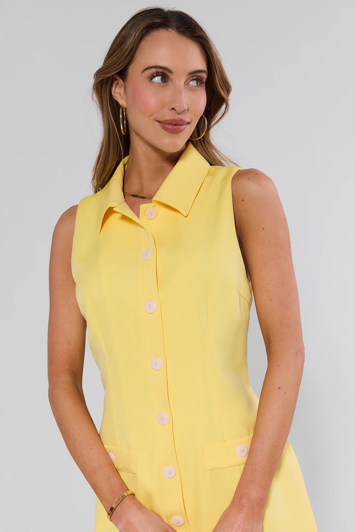Yellow collared sleeveless dress with pink buttons - Close-Up Detail | Avara