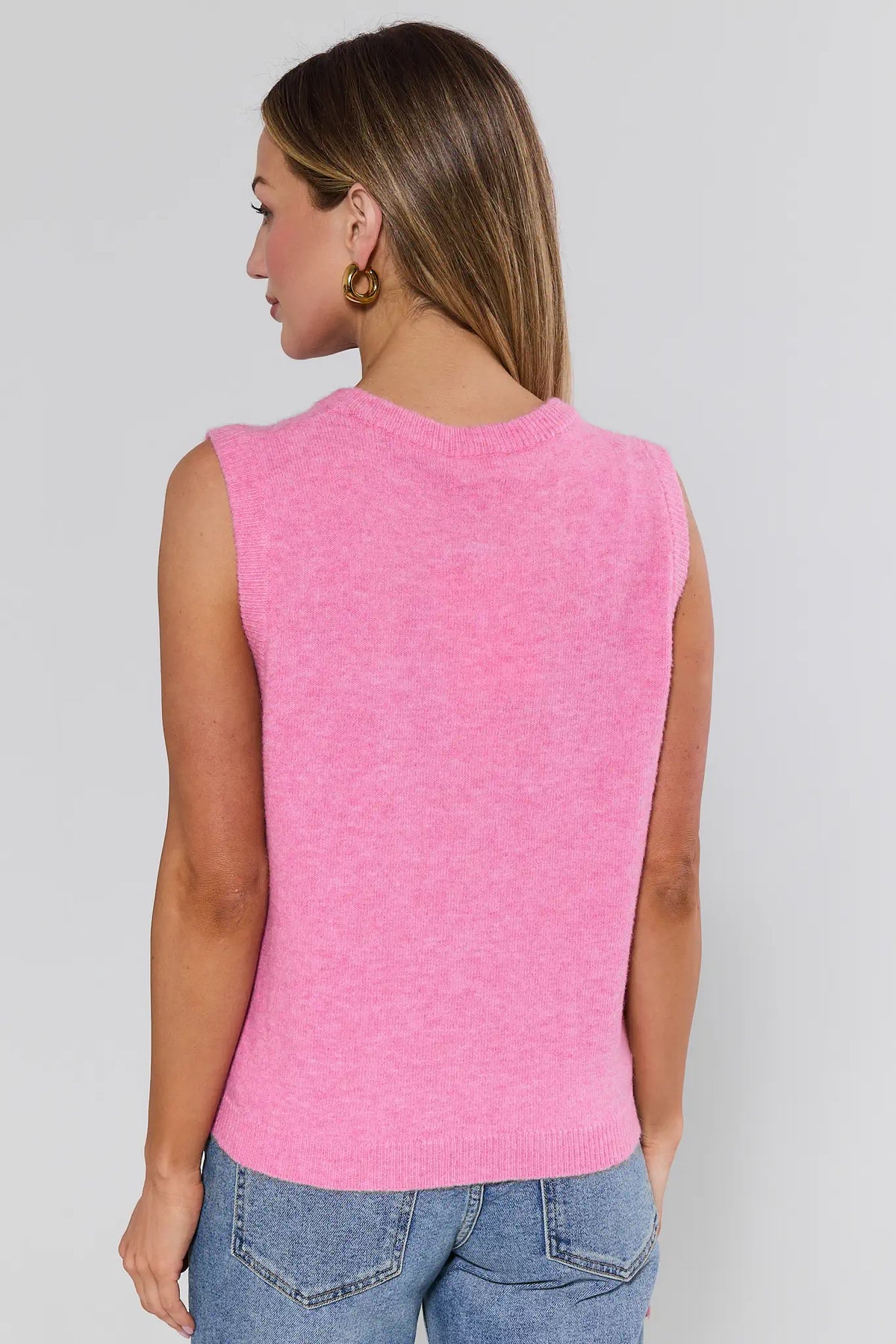 Pink knit sleeveless sweater vest back view showing ribbed hem and clean back - Martha | Avara