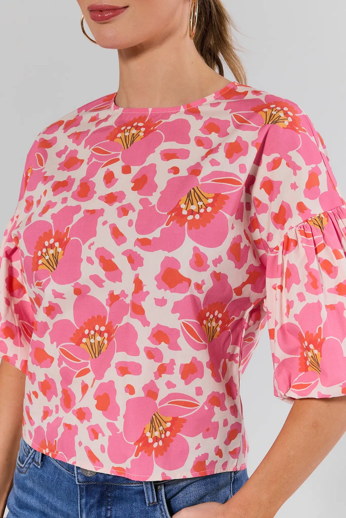 Peyton Pink Floral Print Top close-up showing bold print and ruffle puff sleeve detail | Avara