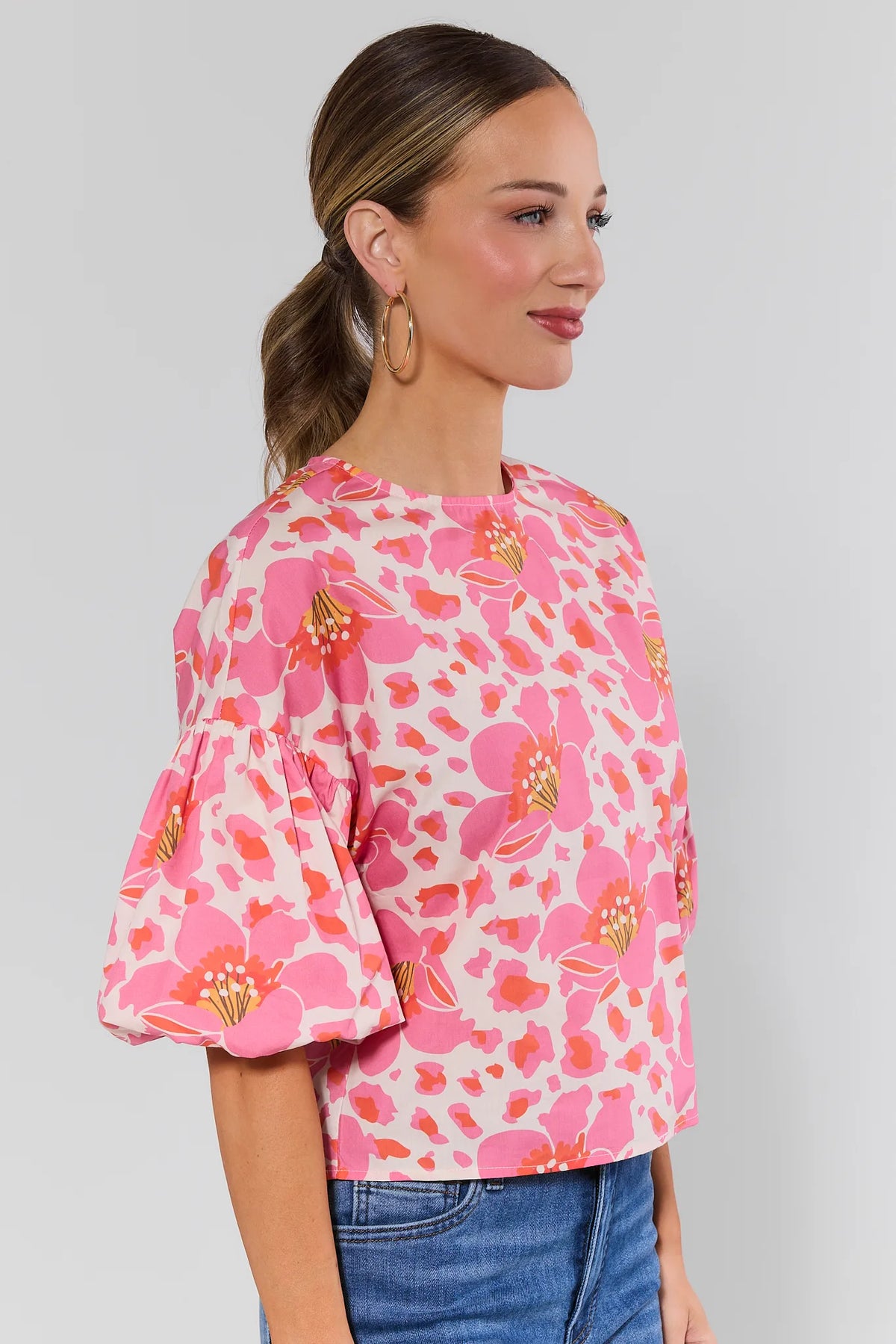 Peyton Pink Floral Print Top with puff sleeves, side profile view styled with denim | Avara