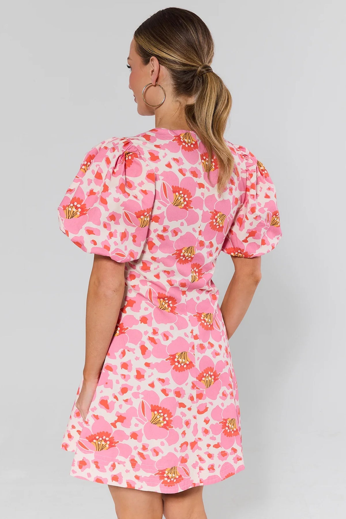 Ruth Pink Floral Print Short Dress back view showing puff sleeves and flared hem | Avara