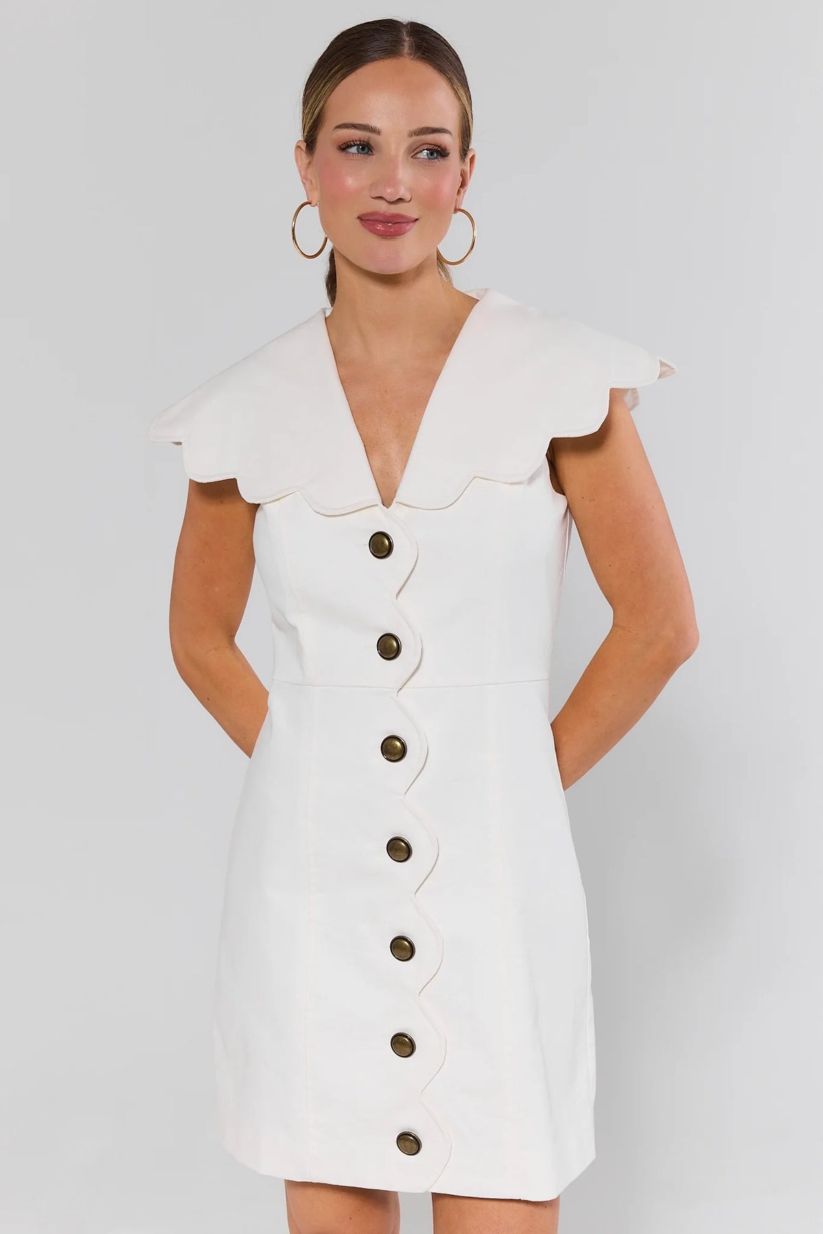 White Scalloped Collar Short Dress with brass buttons, front view on model | Avara