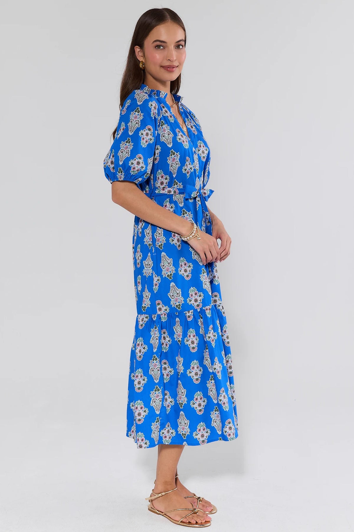 Anita Blue Floral Print Midi Dress, side profile view showing tiered skirt and puff sleeves | Avara