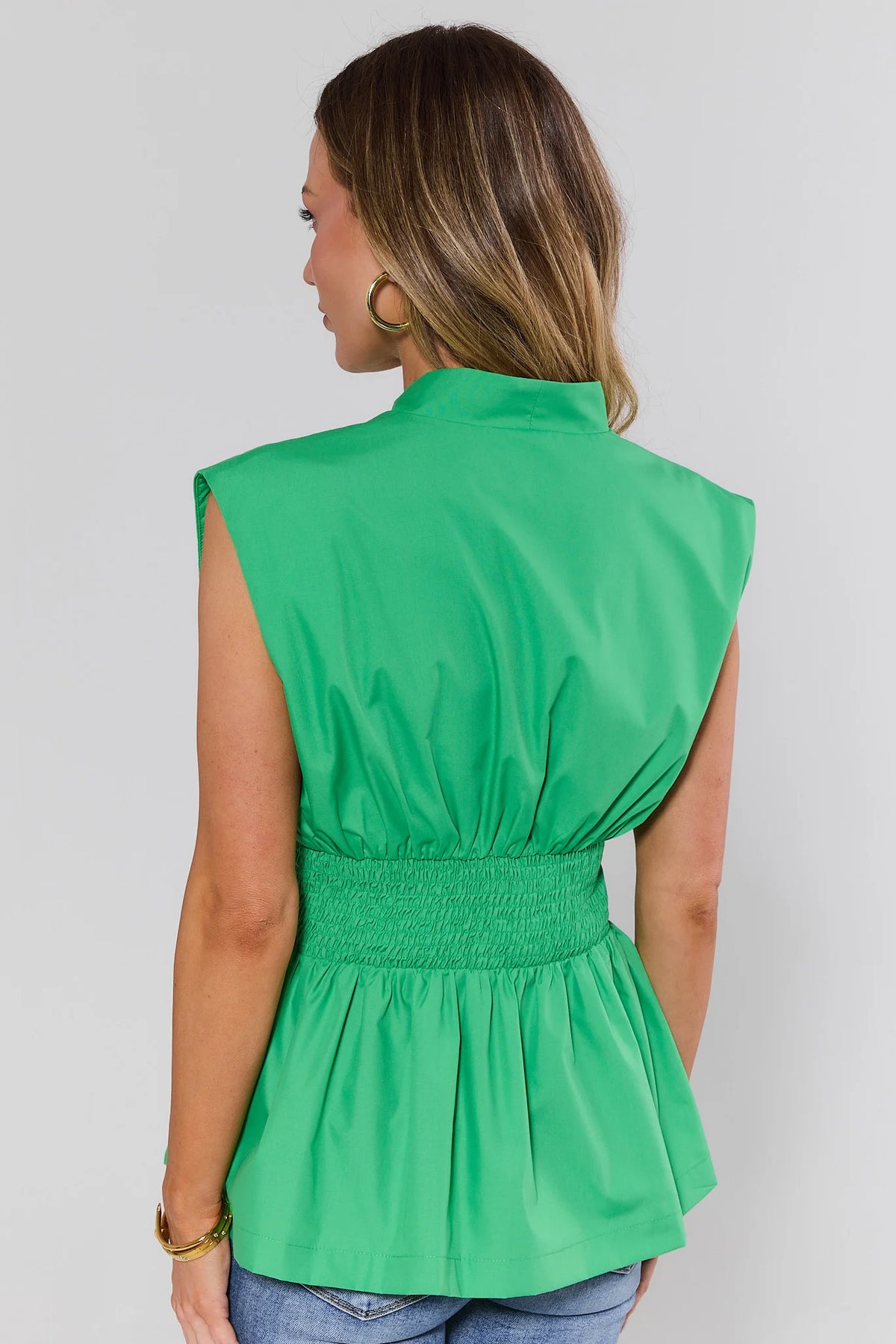 Green Ashley Zip Up Top showing smocked peplum silhouette - Back View, On Model | Avara