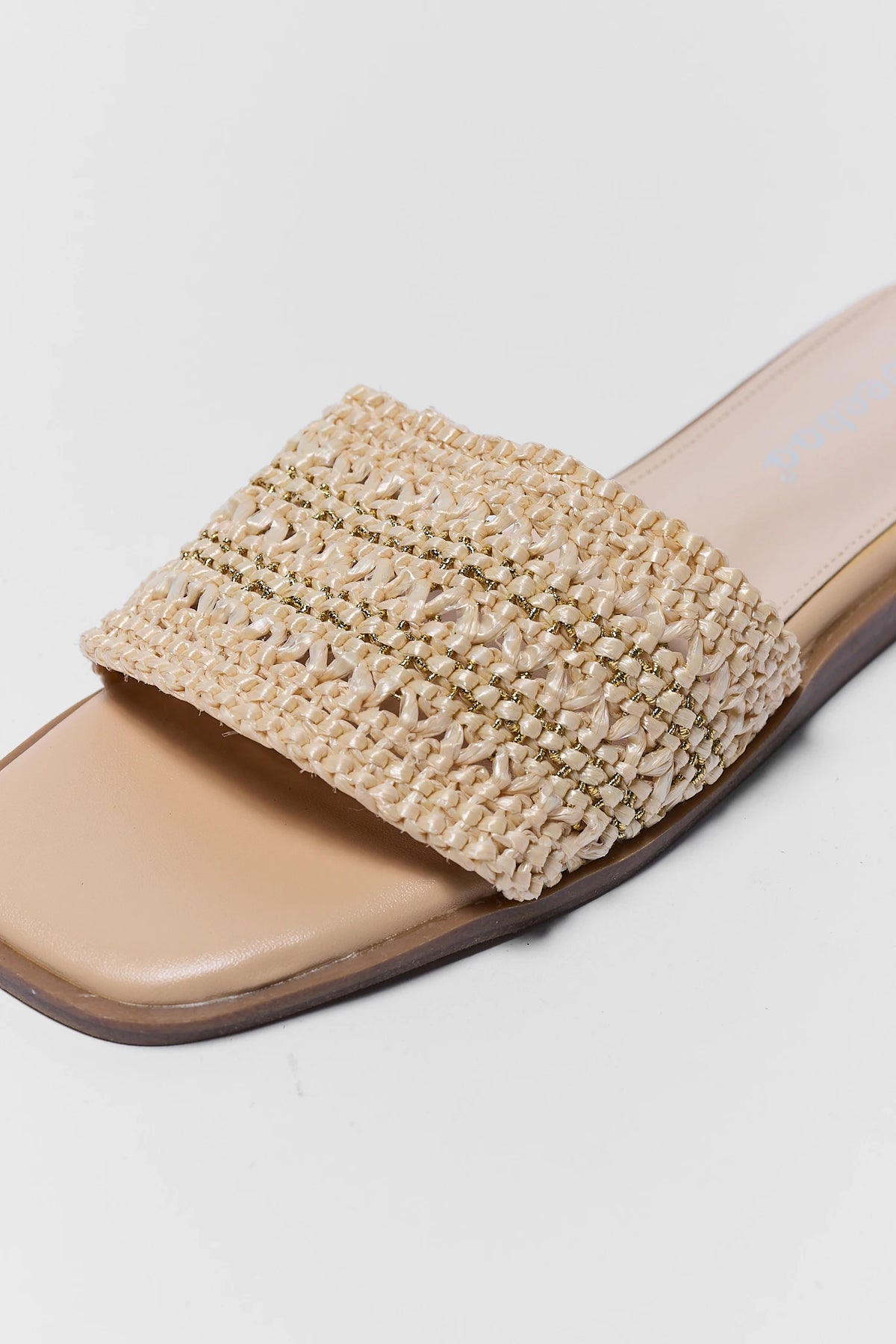 Beige woven sandal on a light gray background