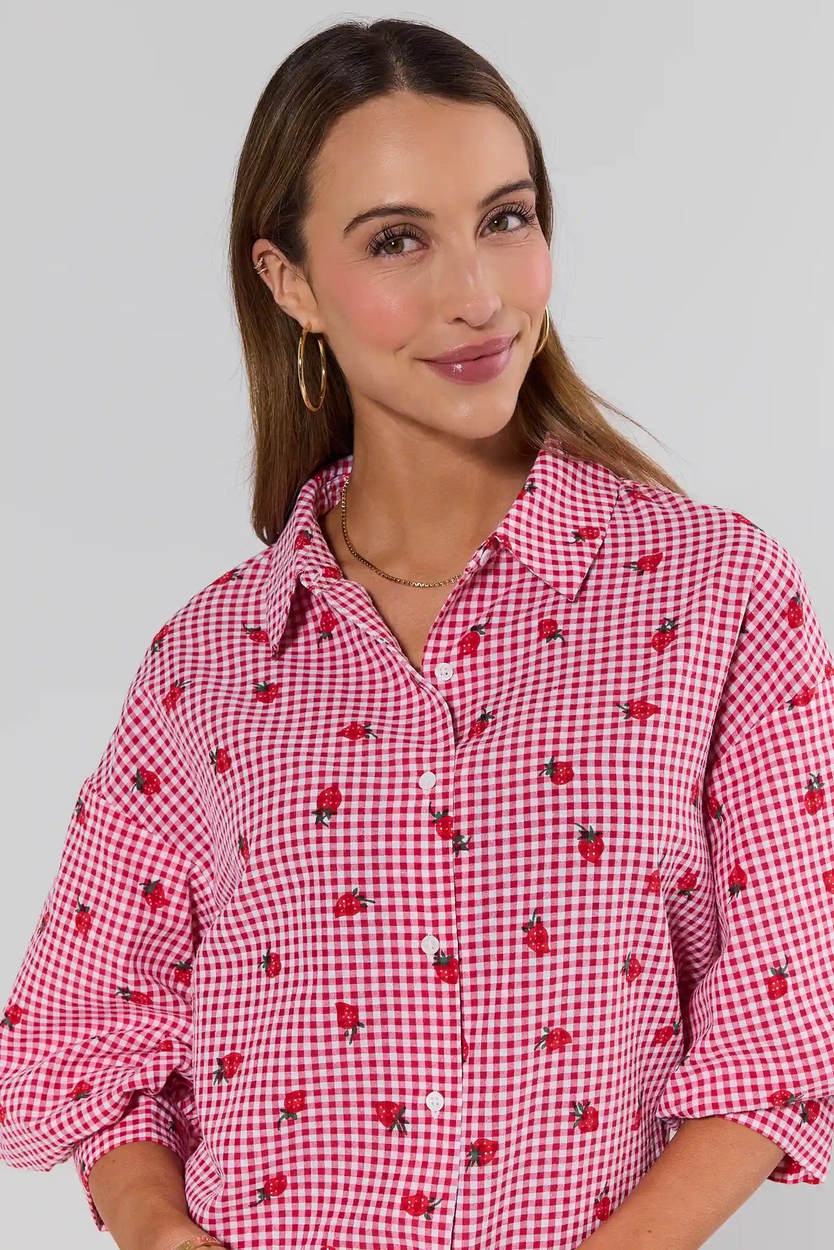 Close-up of Dorthea Red Gingham Top showing strawberry print detail and button collar | Avara