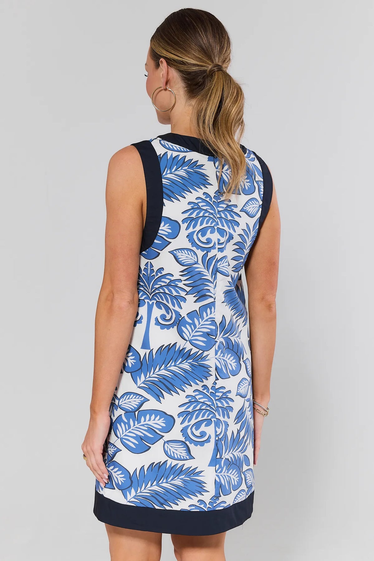 Ester Blue Palm Printed Short Dress with Navy Hem Trim - Back View | Avara