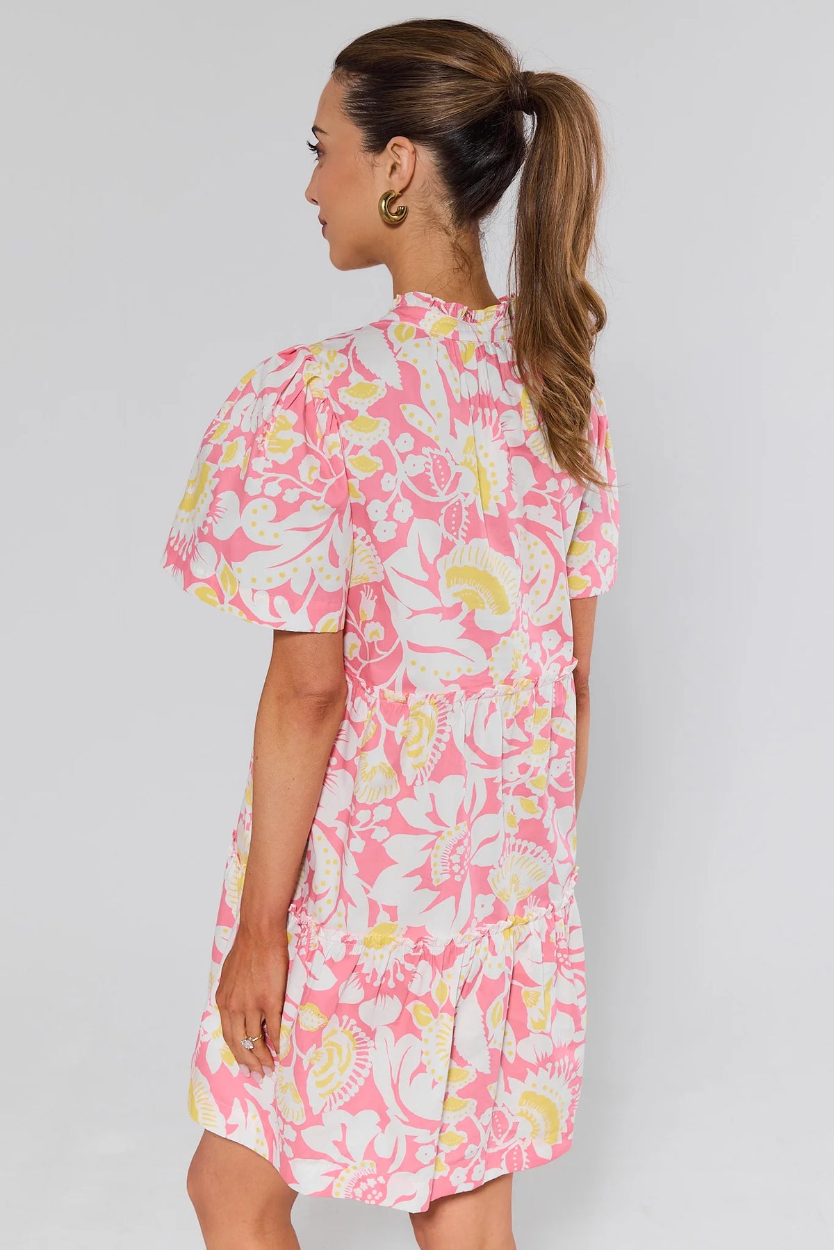 Evan Pink Floral Short Dress back view showing puff sleeve detail and ruffle hem - modest floral dress | Avara