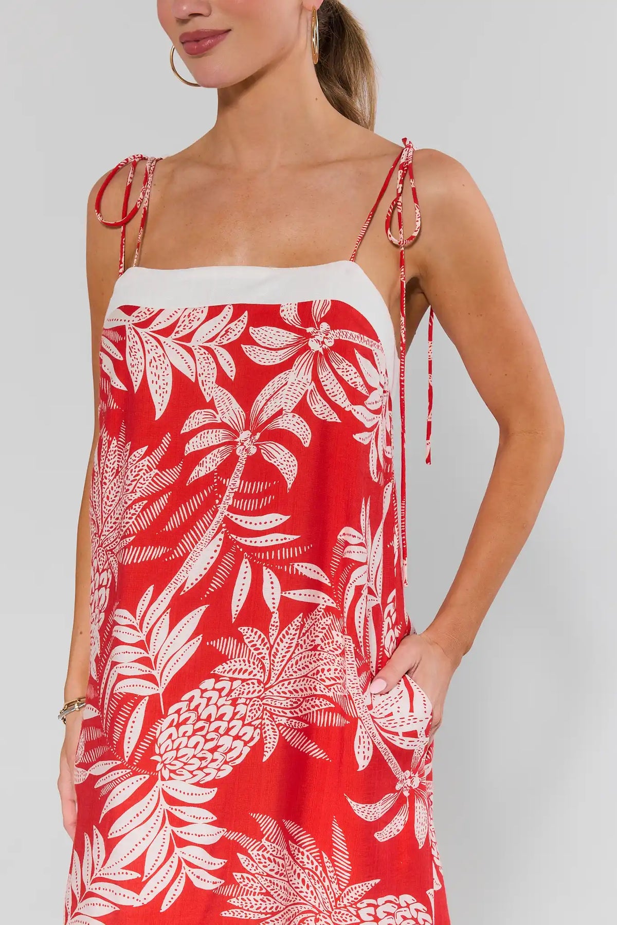Libby Red Printed Short Dress - close-up of tropical palm print, tie-shoulder strap detail | Avara