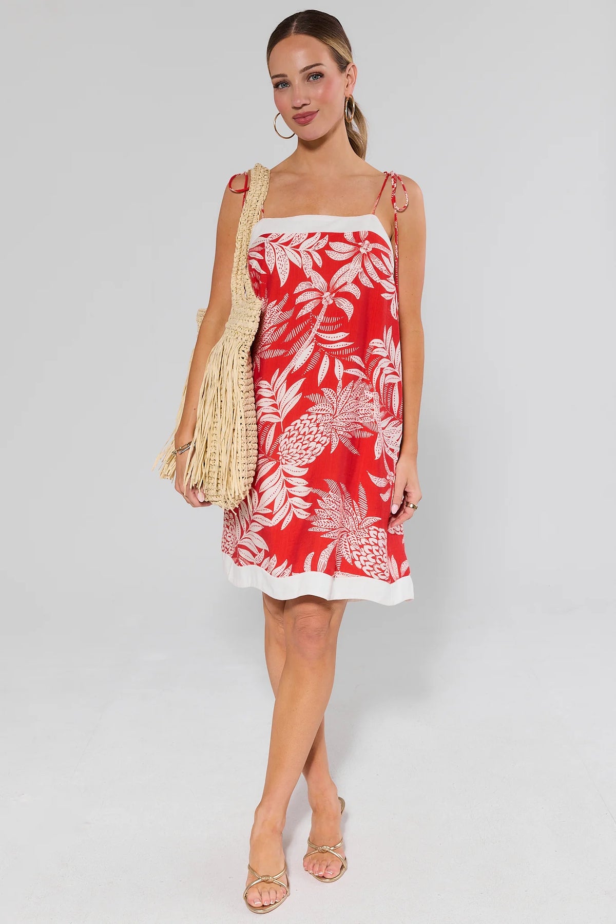 Libby Red Printed Short Dress styled with straw fringe bag and gold sandals, full-length front | Avara