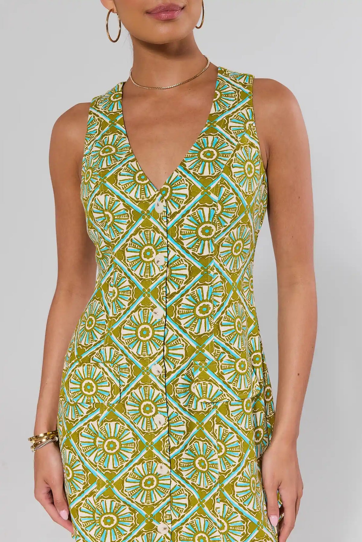 Seraphina Green Printed Short Dress, V-neckline and button detail close-up, tile print | Avara