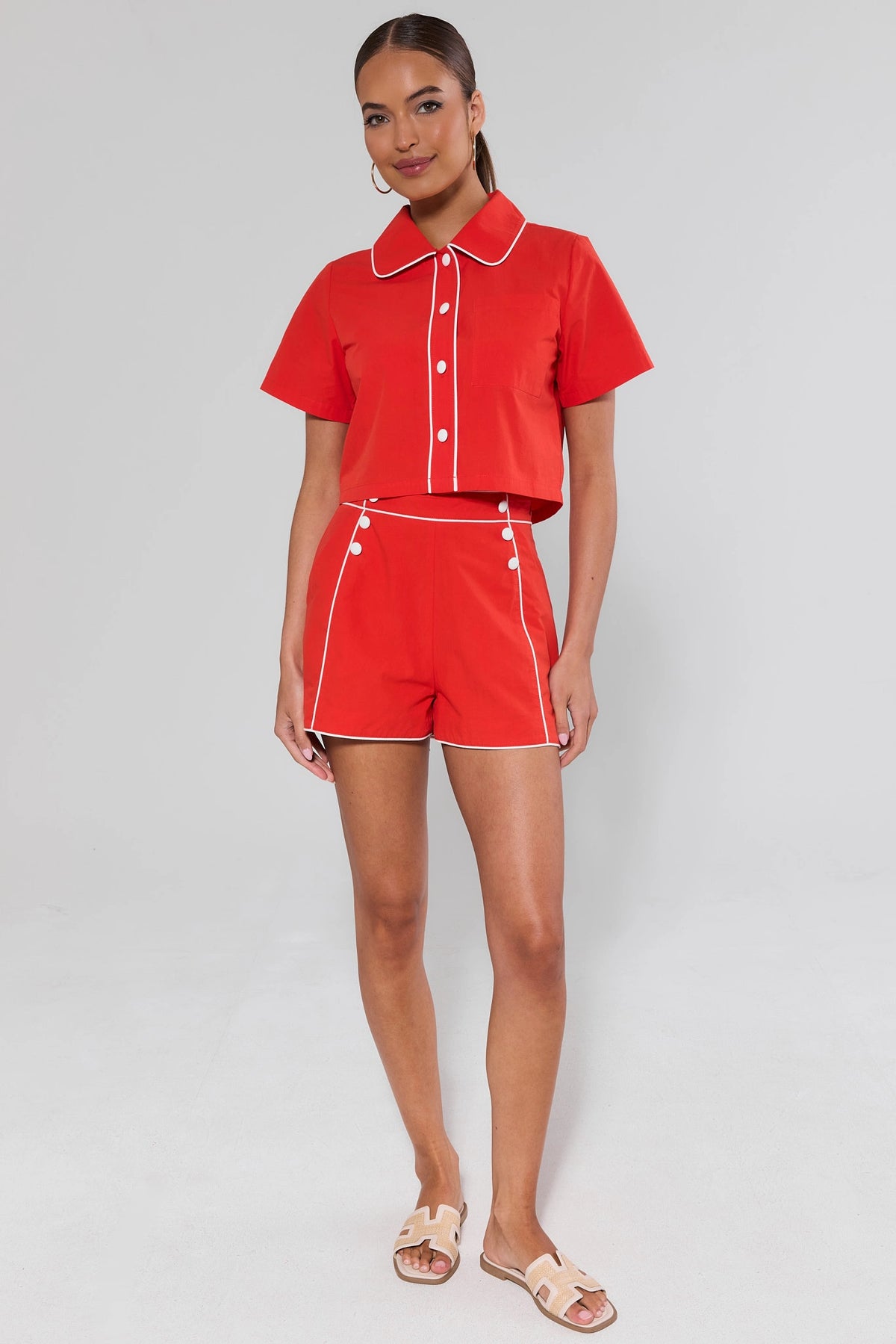 Belle Red Contrast Trim Top and matching shorts with white piping, full-length front view on model | Avara