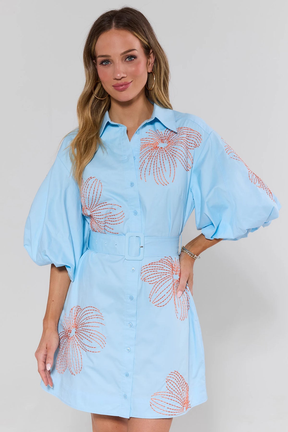 Regina Blue Embroidered Short Dress - Front View with puff sleeves, belted waist, styled with sandals | Avara