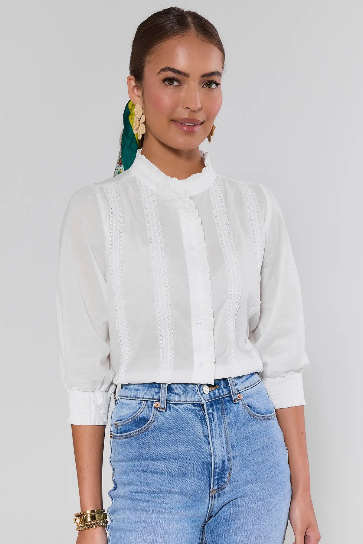 Archer White Button Up Top with lace-inset detail and ruffle neckline, styled with blue jeans - Front Angle | Avara