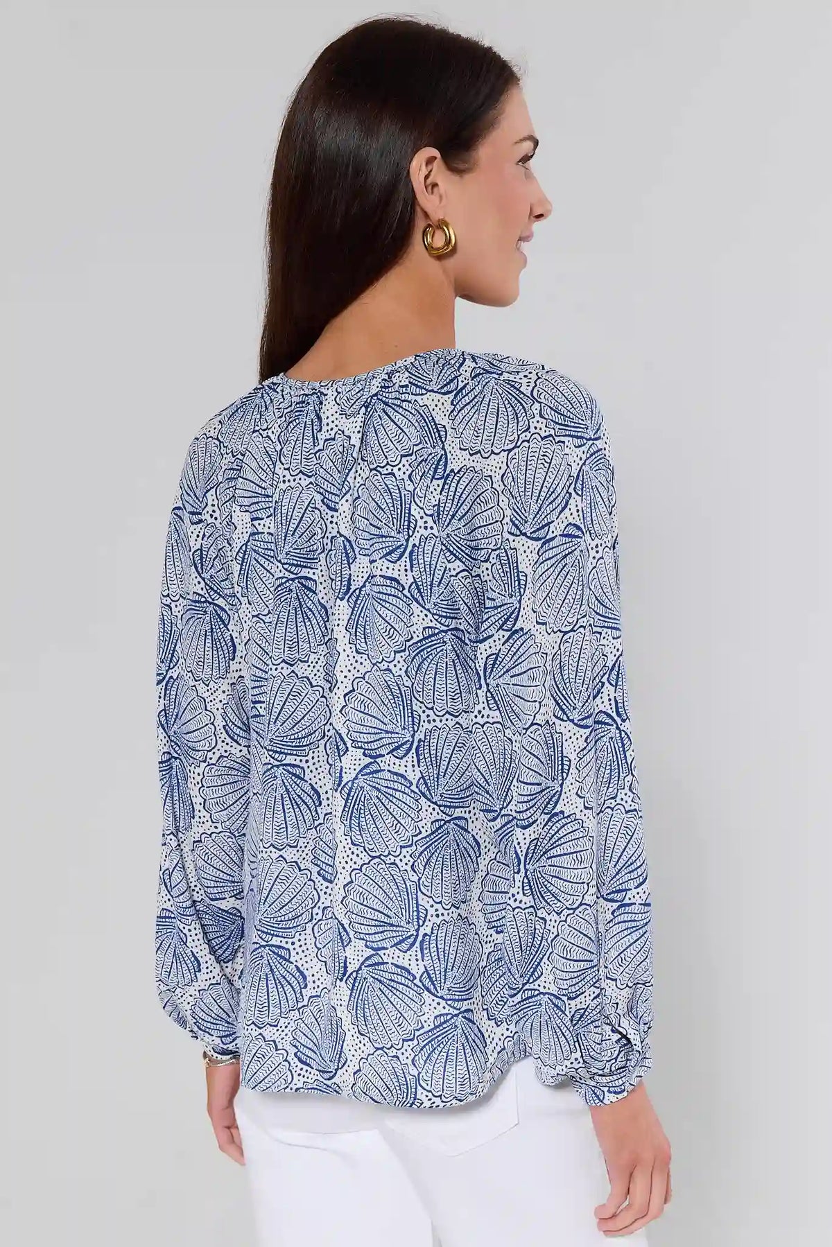 Back view of women's blue shell print top with scalloped hem and long balloon sleeves | Avara