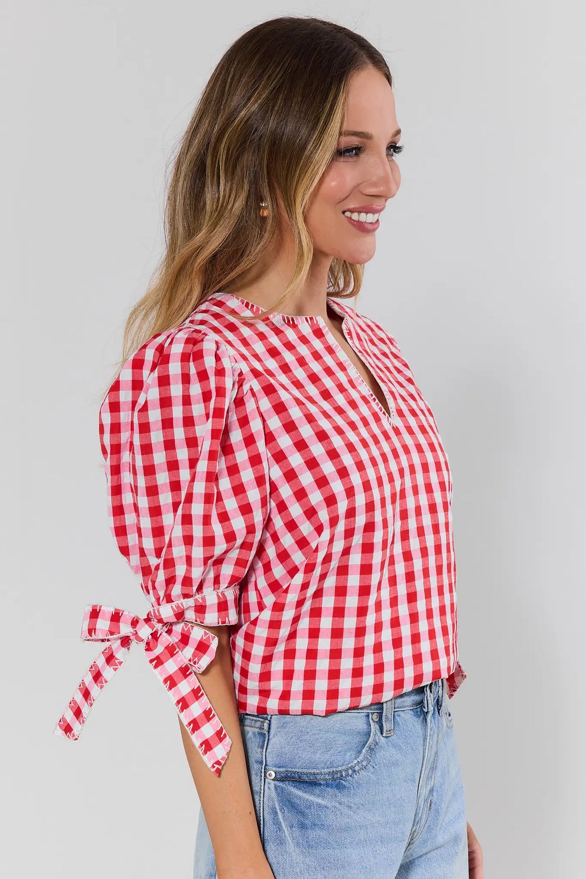 Red gingham puff sleeve top with tied sleeve detail - Side Profile View | Avara