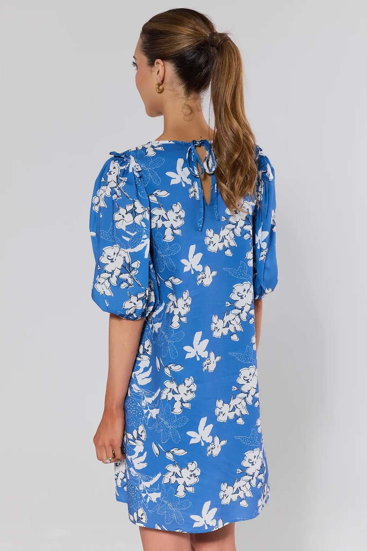 Blue floral puff sleeve short dress with tie-back keyhole closure - Back View | Avara