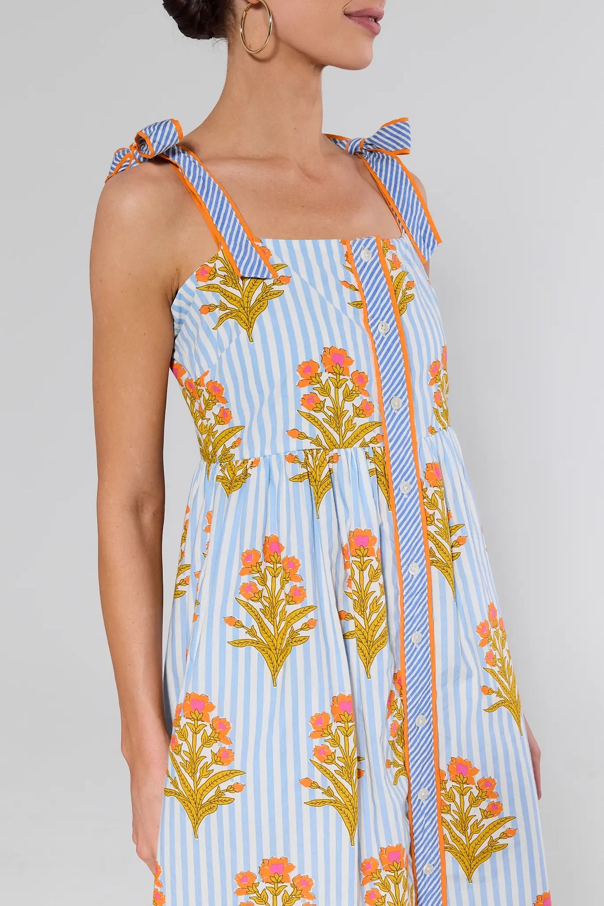 Blue Striped Floral Print Maxi Dress bodice detail with tie-bow straps and button placket | Avara