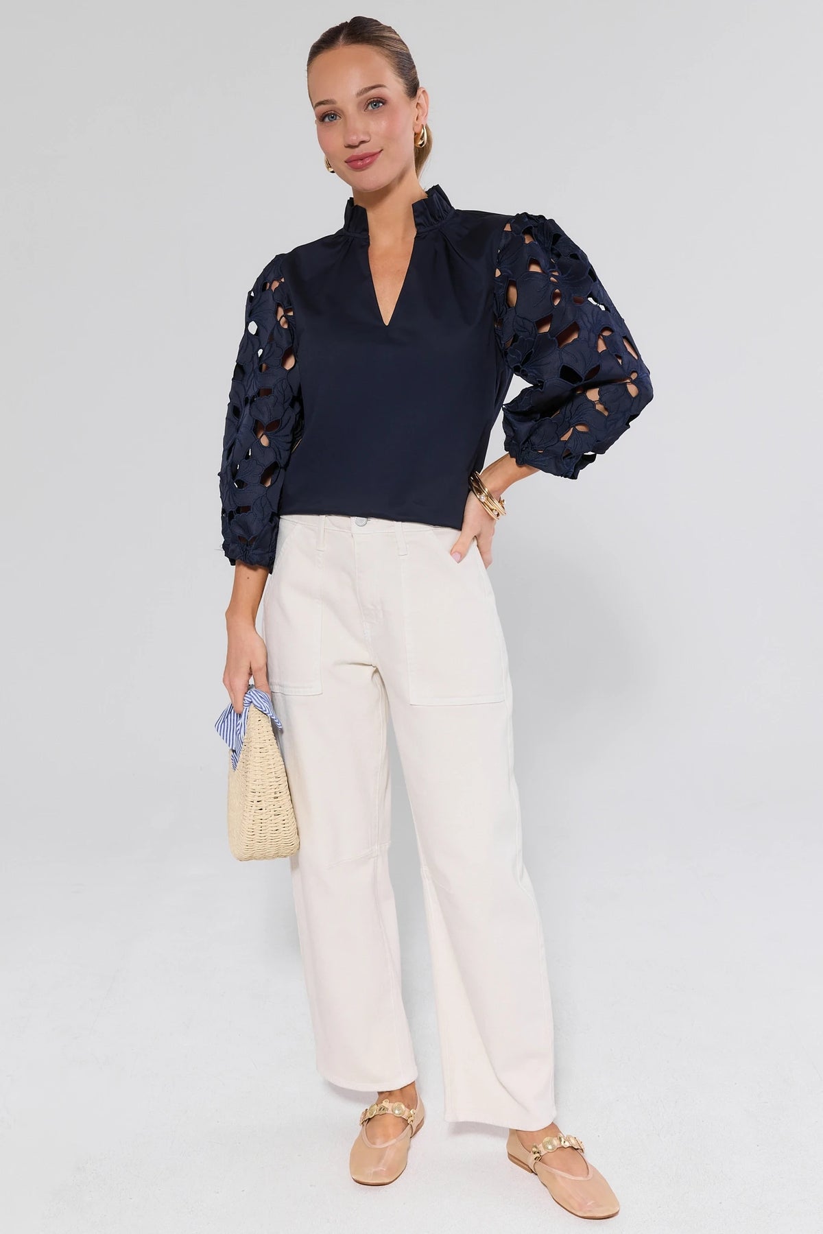 Navy eyelet sleeve top by THML styled with wide-leg cream pants and straw bag - Full Length On Model | Avara