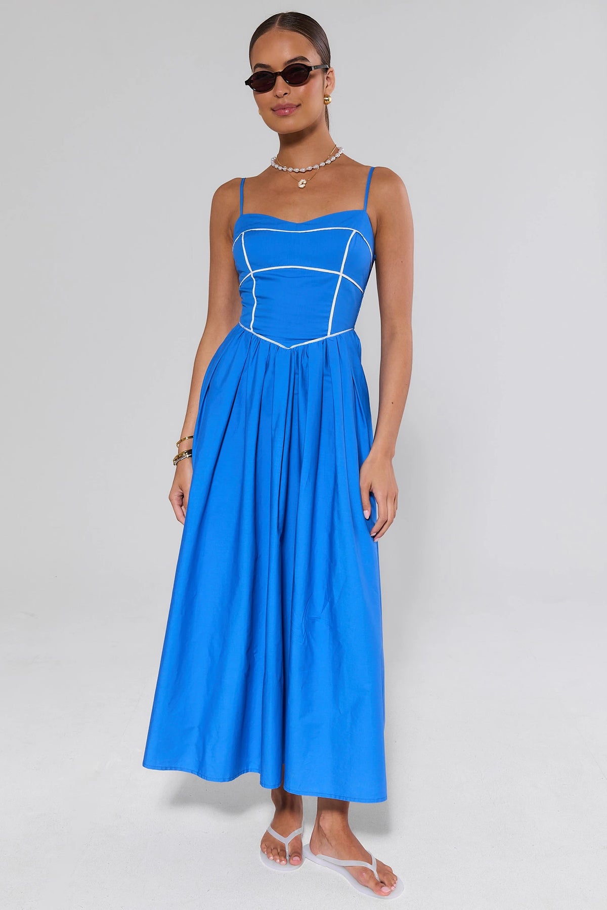 Blue A-line Maxi Dress with sunglasses full-length on model - Front View | Avara