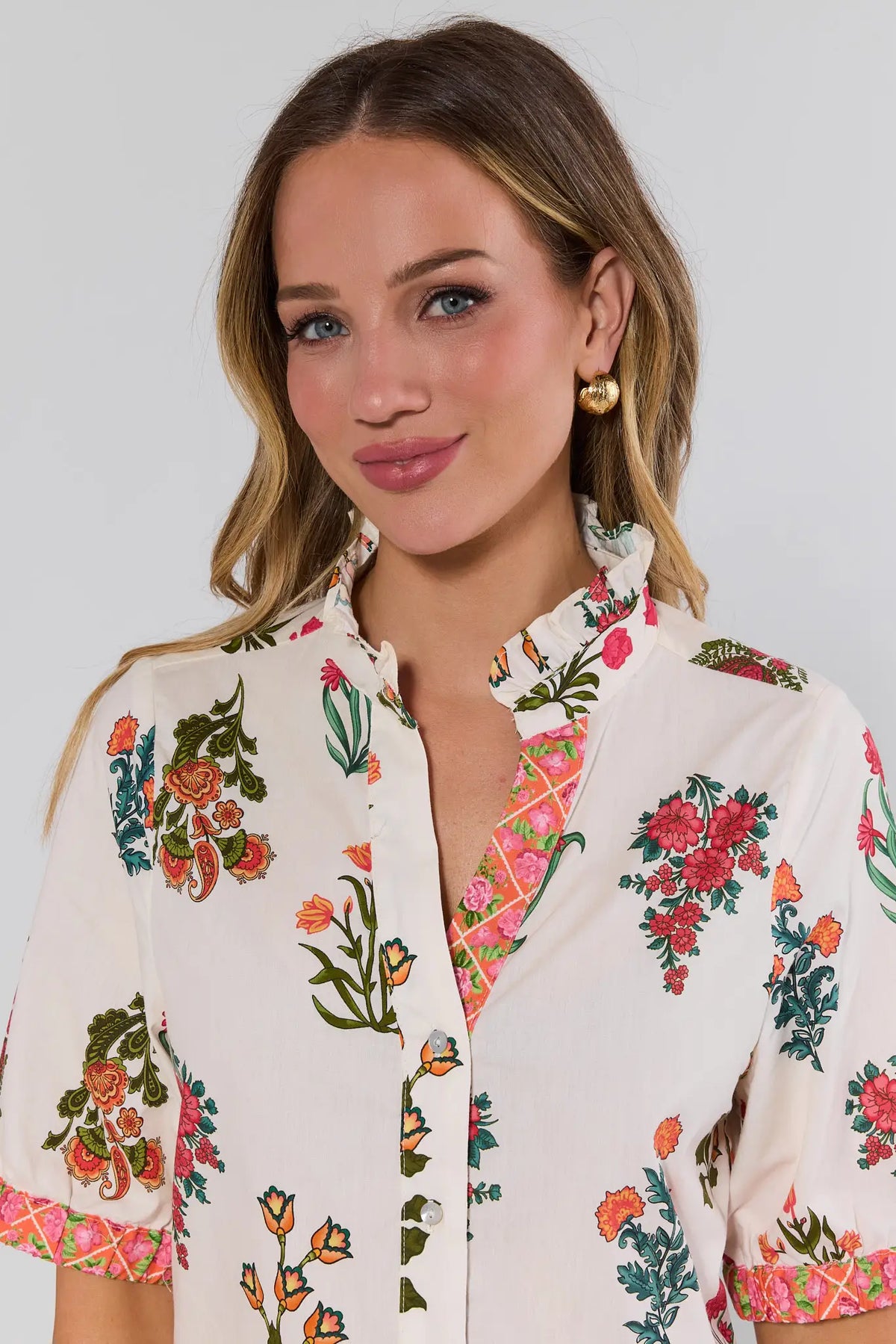 Close-up of white THML floral top showing ruffled collar, contrast placket, and pink botanical print - Detail View | Avara
