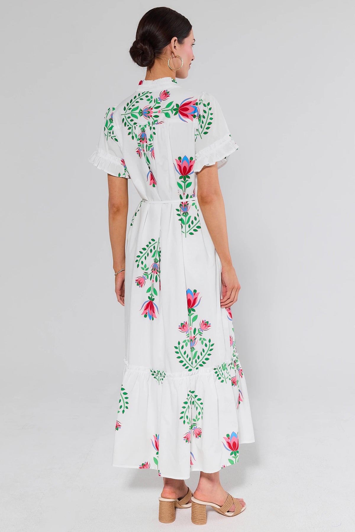 White Floral Printed Maxi Dress back view showing tiered ruffle hem and flutter sleeves, modest floral dress | Avara