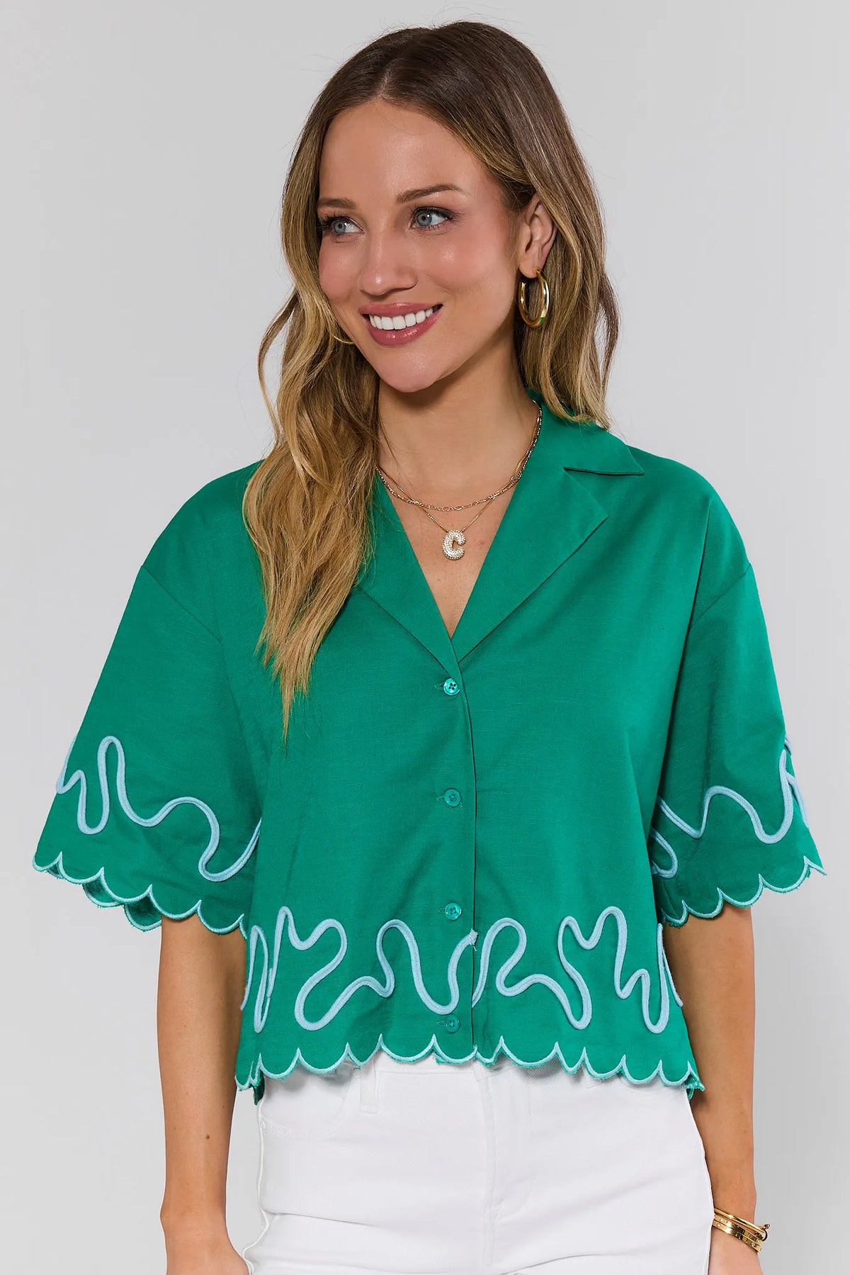 Green Scalloped Trim Top with white embroidery worn with white jeans - Front View | Avara