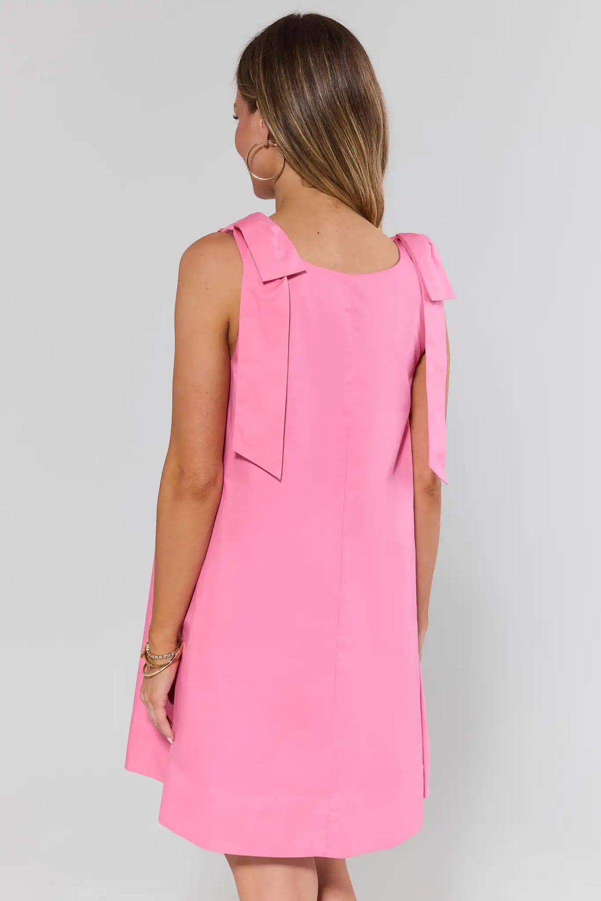 Pink bow strap short dress showing A-line back and shoulder bow details - Back View | Avara
