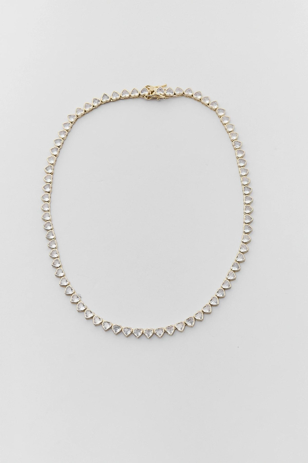 Gold Heart Bezel Tennis Necklace with CZ stones - Flat Lay | Avara