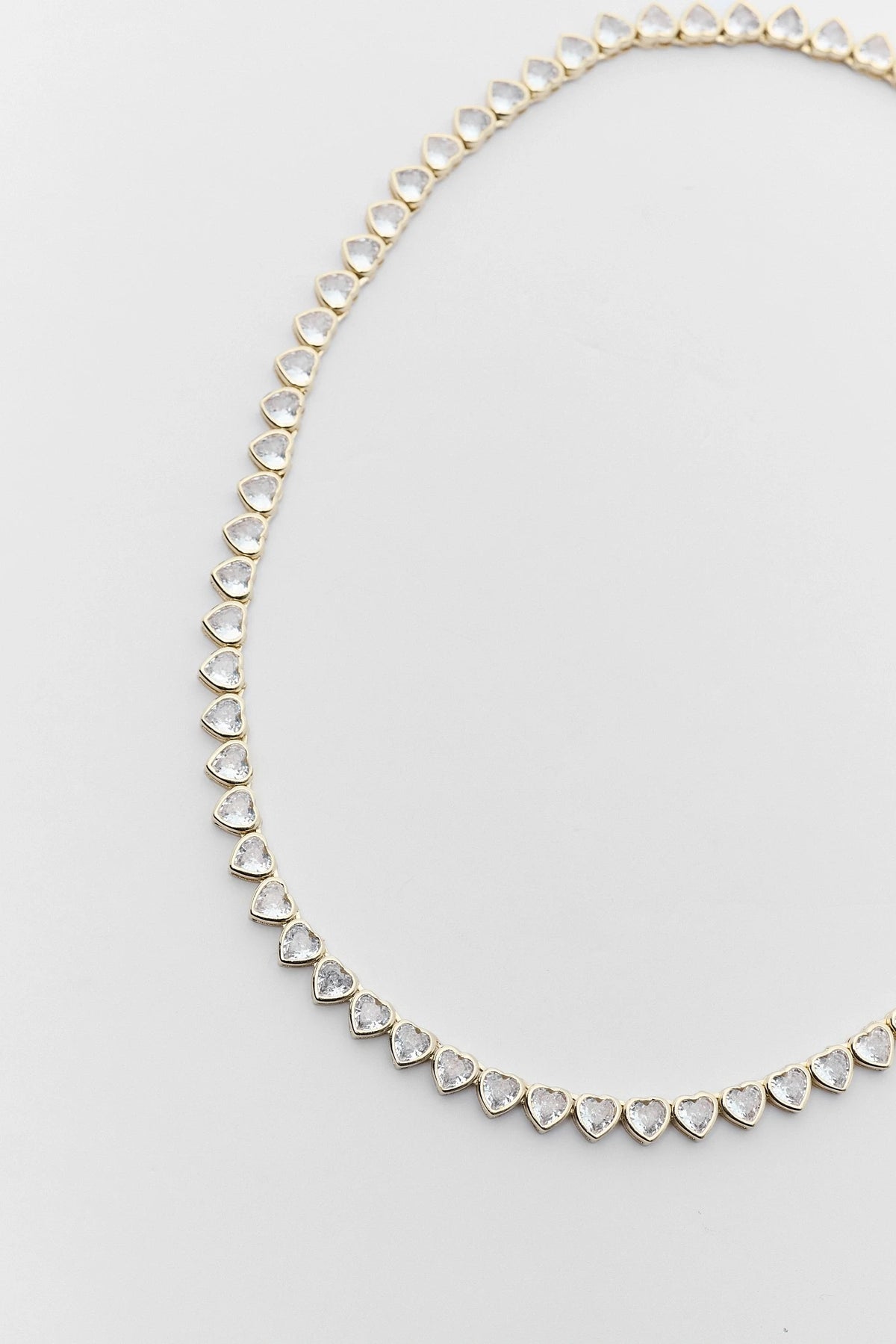 Gold Heart Bezel Tennis Necklace with CZ heart stones - Close-Up Detail | Avara