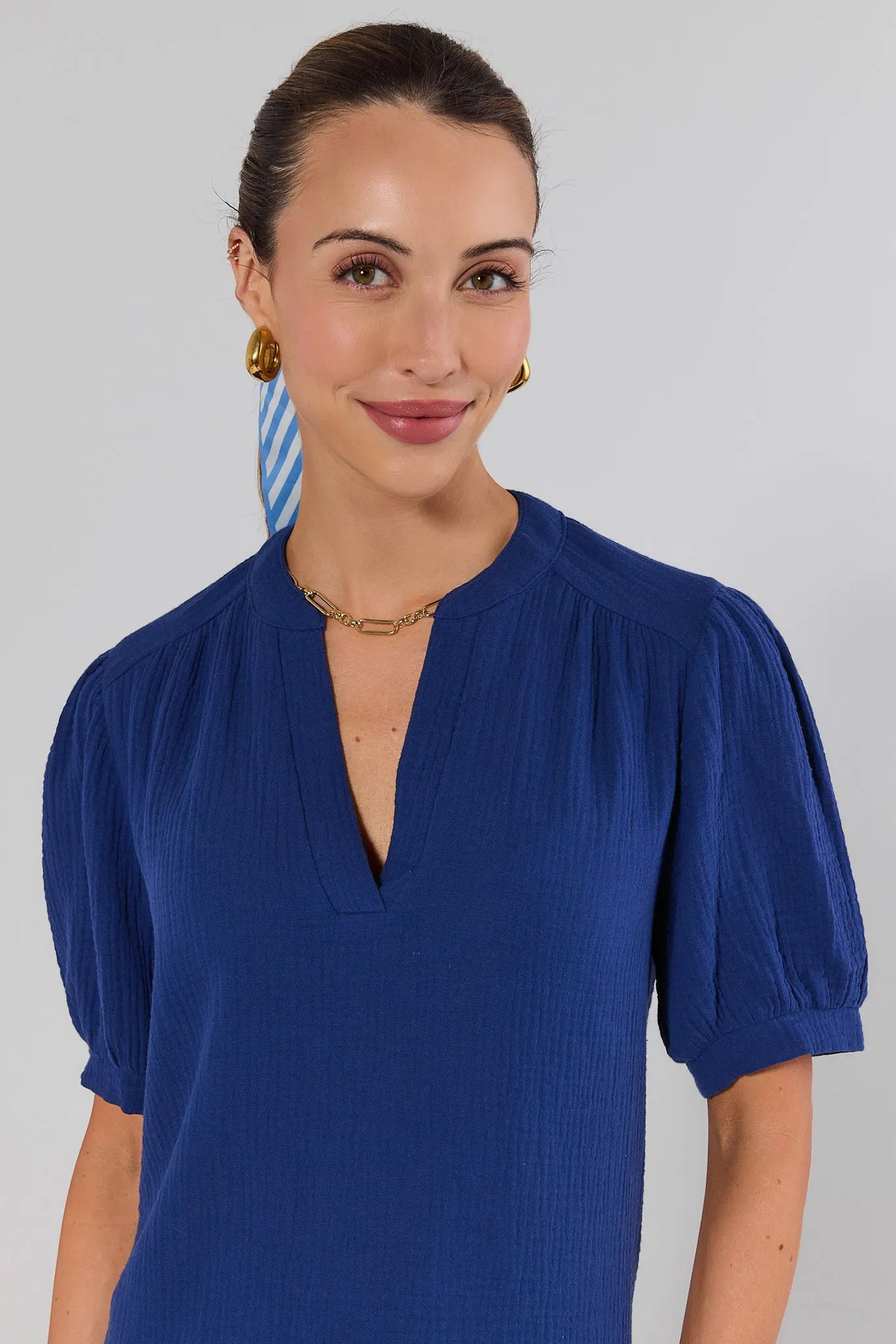 Close-up of Tammy Navy Gauze Top showing textured fabric, puff sleeves, and split V-neckline detail | Avara