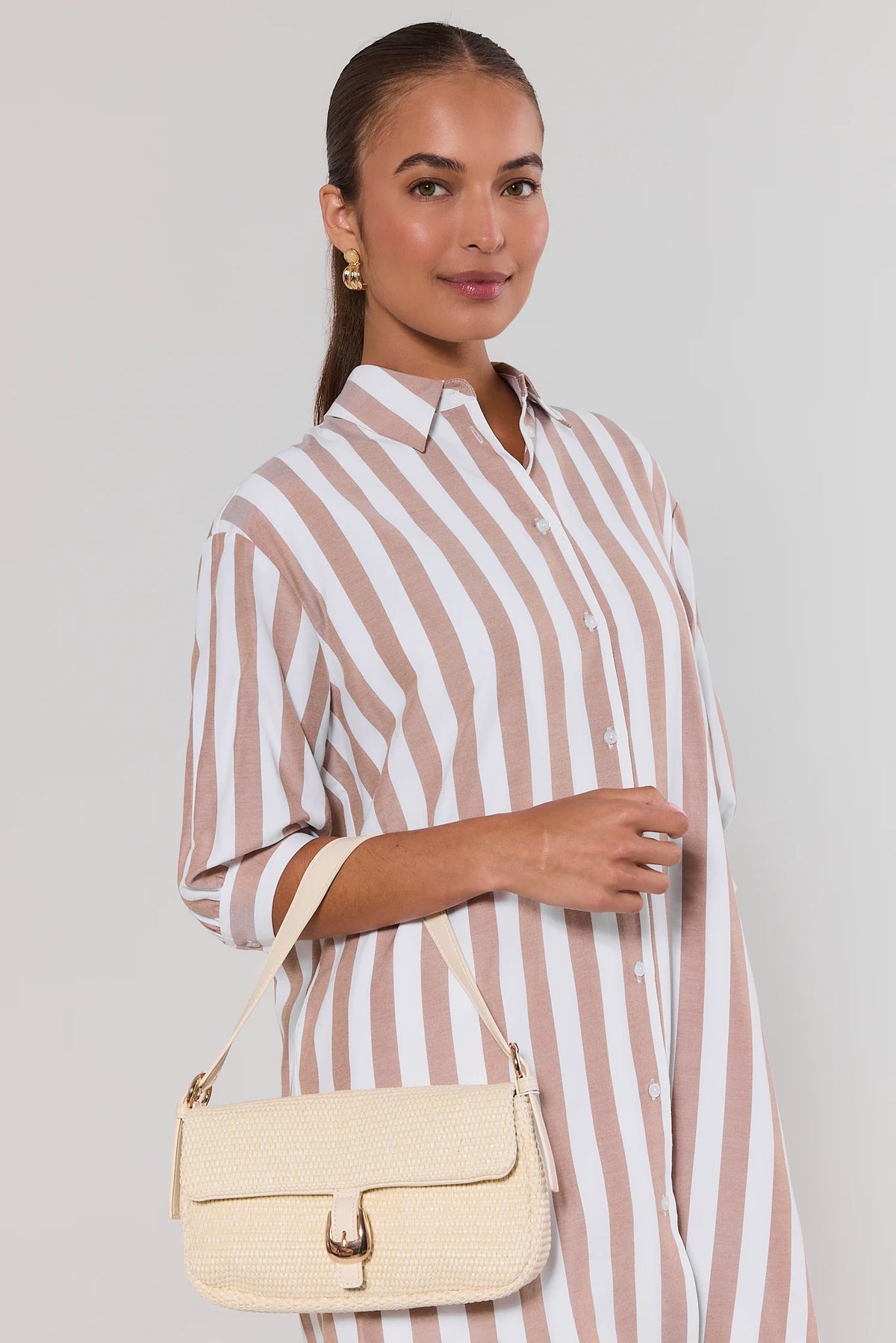 White raffia shoulder bag styled on model in striped shirt dress - On Model Styled Look | Avara