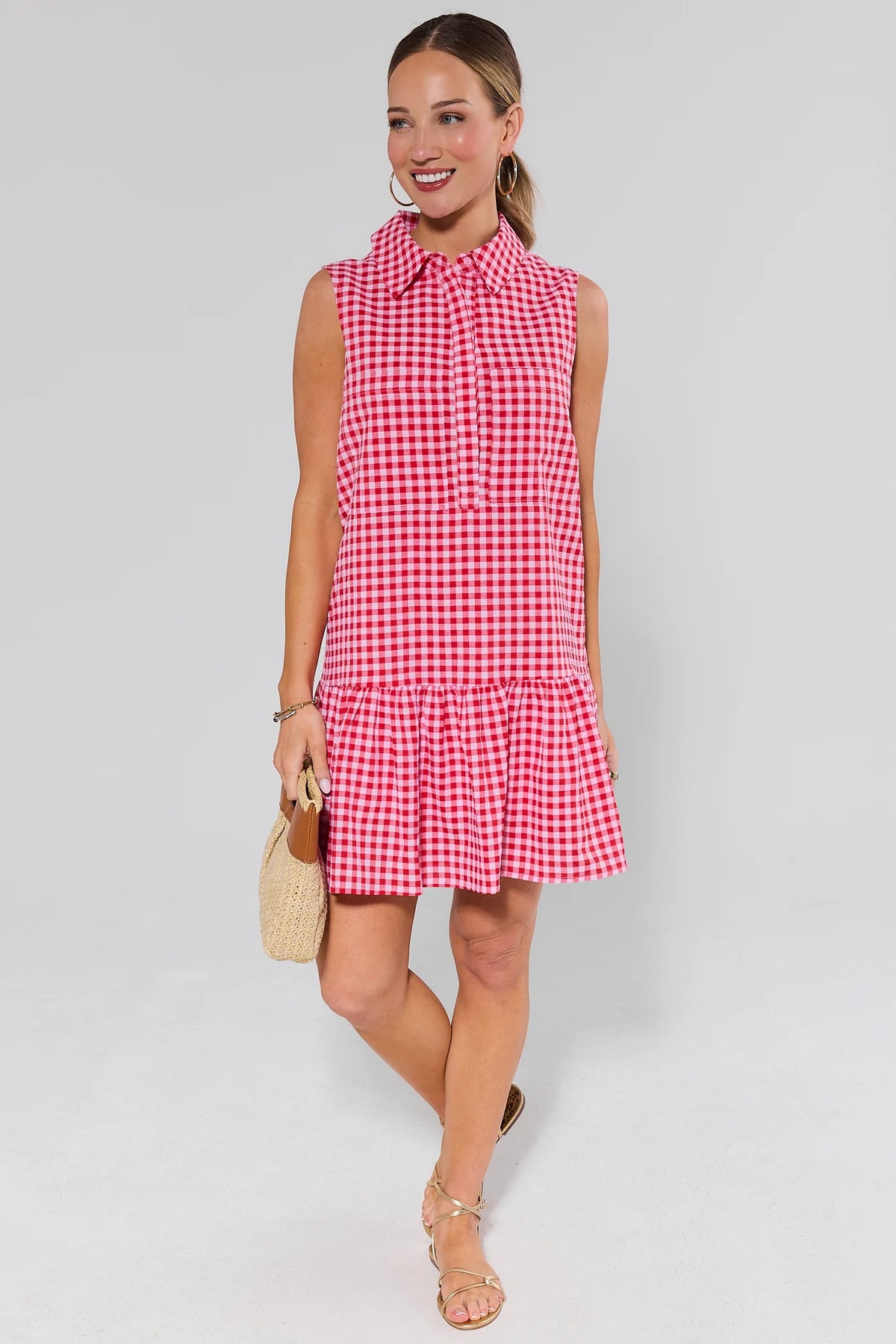 Woman wearing red gingham short dress with gold sandals and woven bag - Full Length Styled Look | Avara