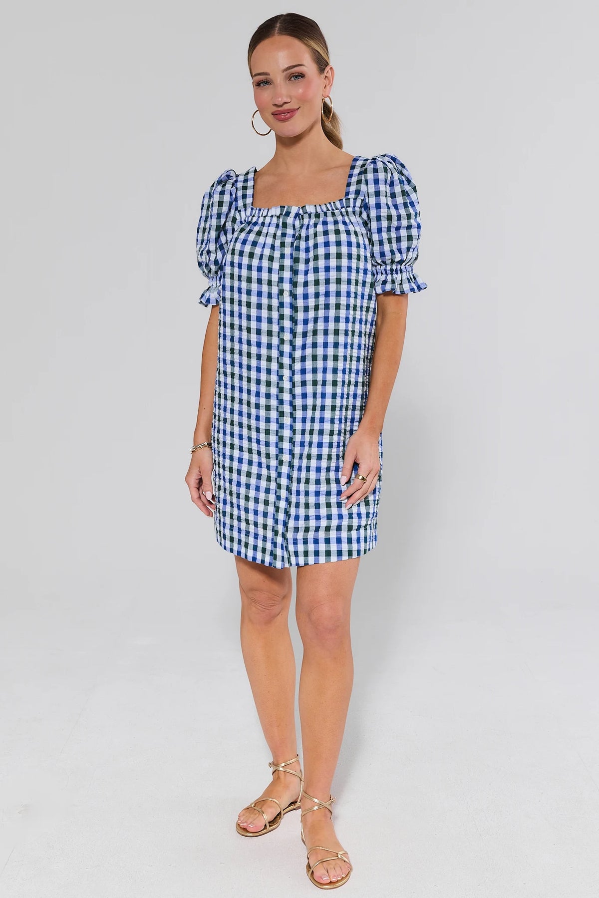 Navy gingham short dress styled with gold sandals, full-length front view on model | Avara