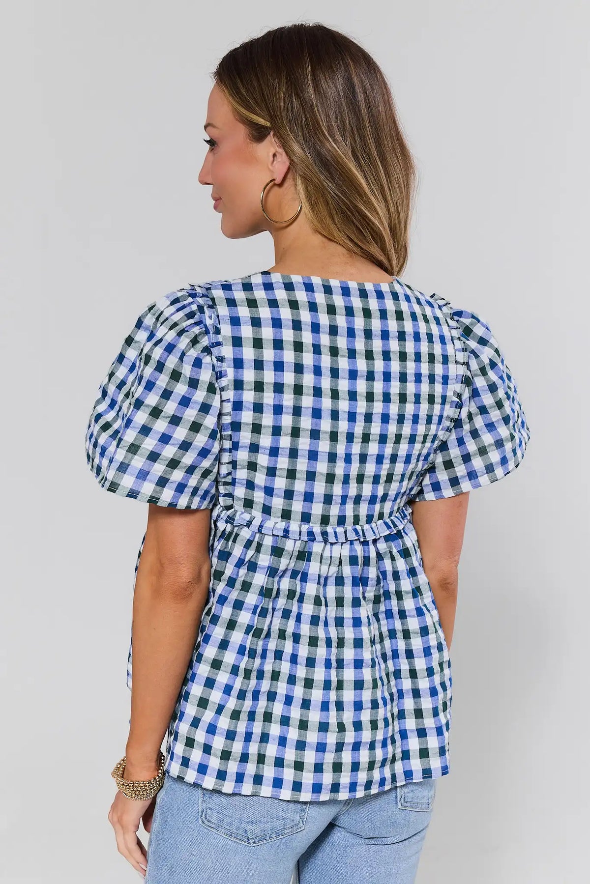 Blue gingham peplum top back view showing smocked detail and puff sleeves | Avara